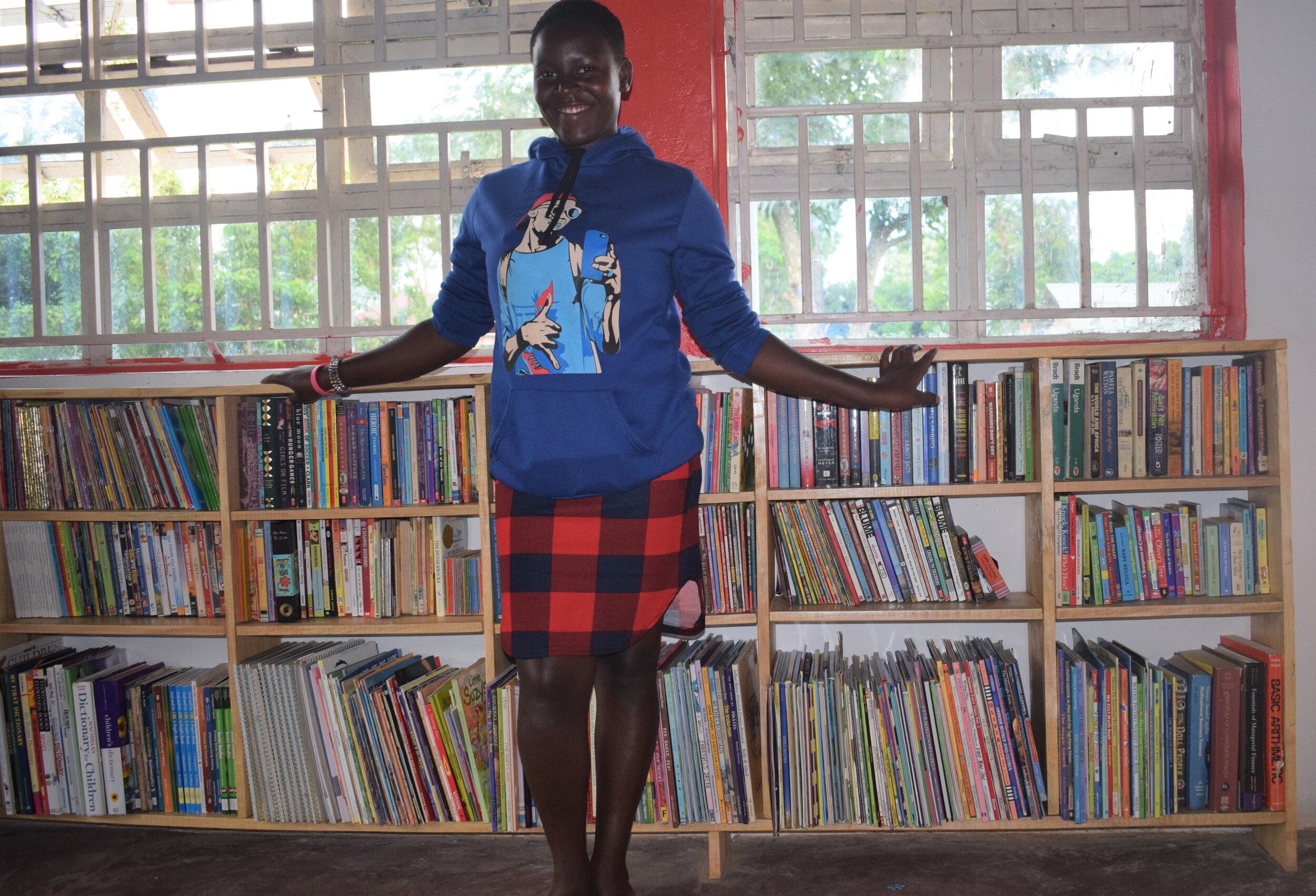 Jackie smiles with the of having a school library.jpg