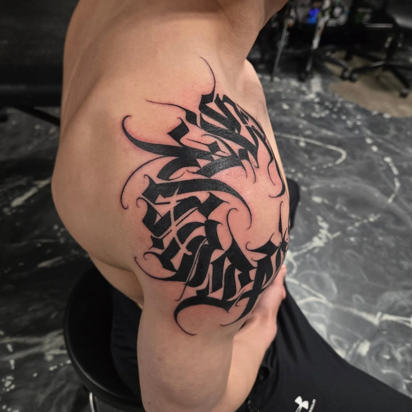 &quot;Conviction&quot; around the shoulder, thanks again Jack for coming down and letting me do your first tattoo 🙏

This is the second time I've done one of these on the shoulder like this. It was really hard to get it laid out but we got it to wor