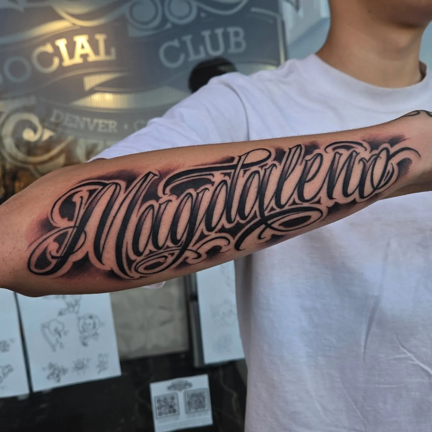 "Magdeleno" script across the forearm. 
Im always down to do some more lettering in this script style, for booking email me at Aaron@diaztattoos.com or dm me here
