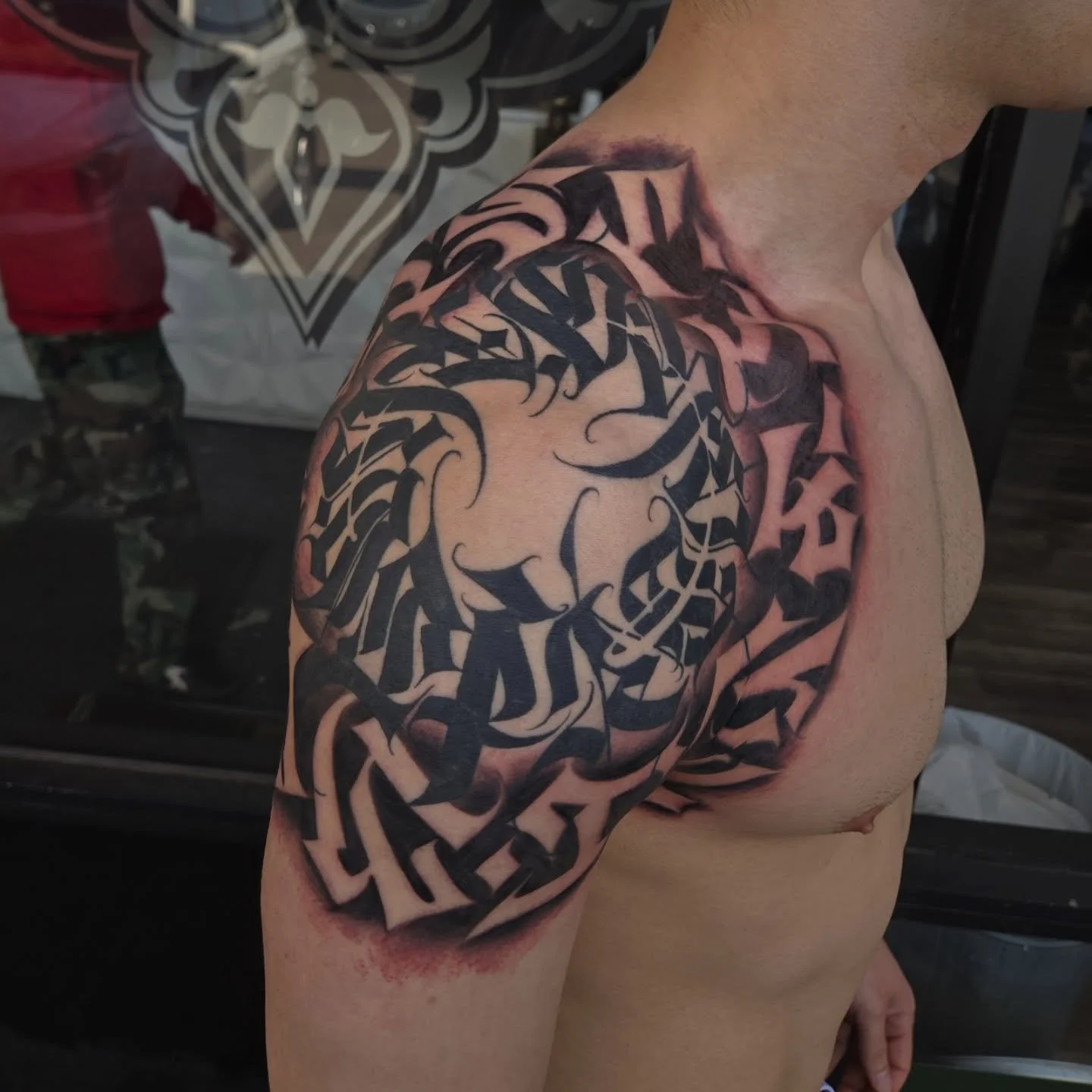 Added some negative letters to this shoulder piece for @get_jacked_1013 very cool idea he had for this one and different then anything I've done before. Now can't wait to see it all healed up. 
Booking may, dm me or email me at Aaron@diaztattoos.com 