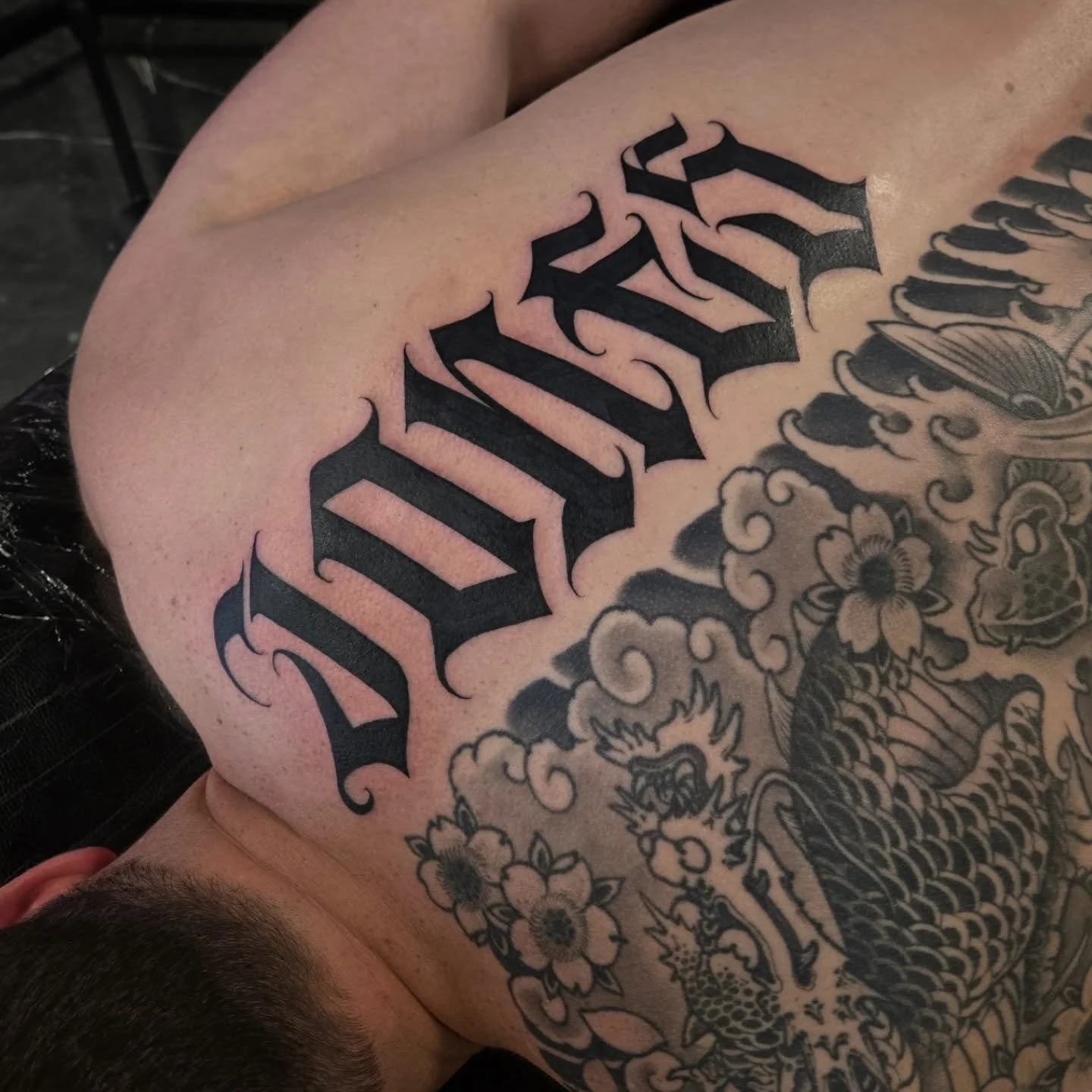 "Jones" Custom calligraphy going down the back. I always love doing bigger pieces likes these, for booking appointments dm me here or email me at Aaron@diaztattoos.com to book your next tattoo. Custom lettering, black and grey or lettering.