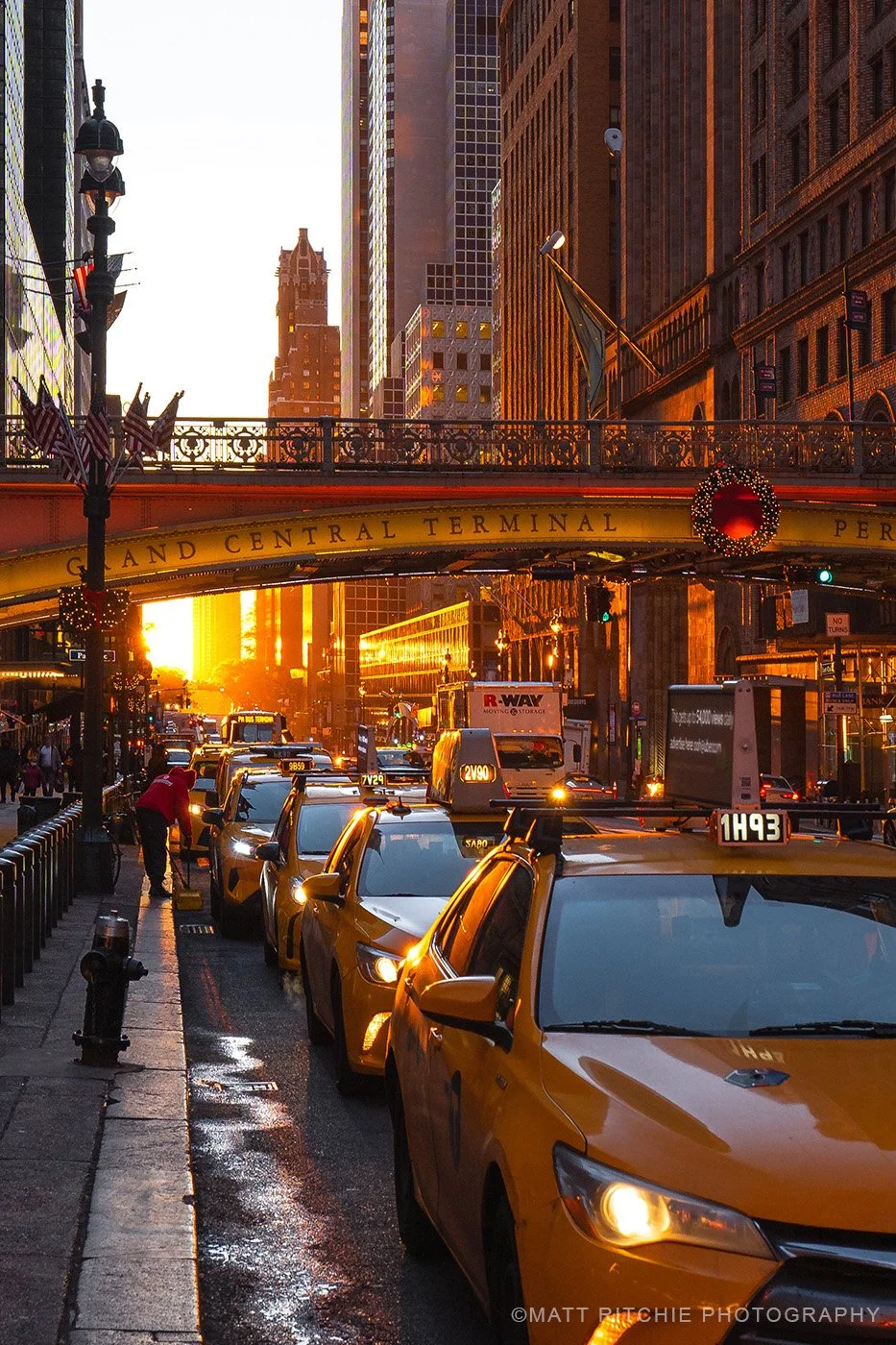 Reverse Manhattanhenge sunrise framed by Midtown Manhattan streets