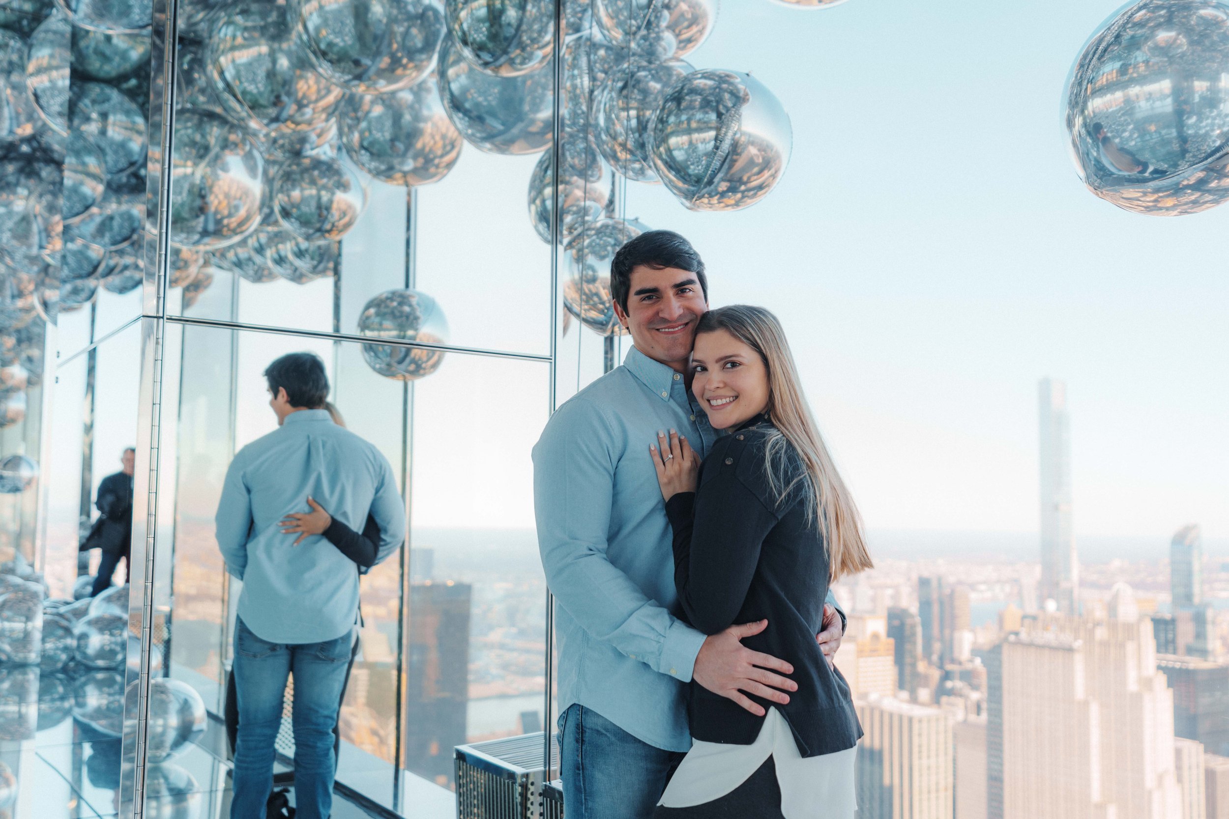 A beautiful marriage proposal and engagement photoshoot at SUMMIT One Vanderbilt in New York City captured by Matt Ritchie