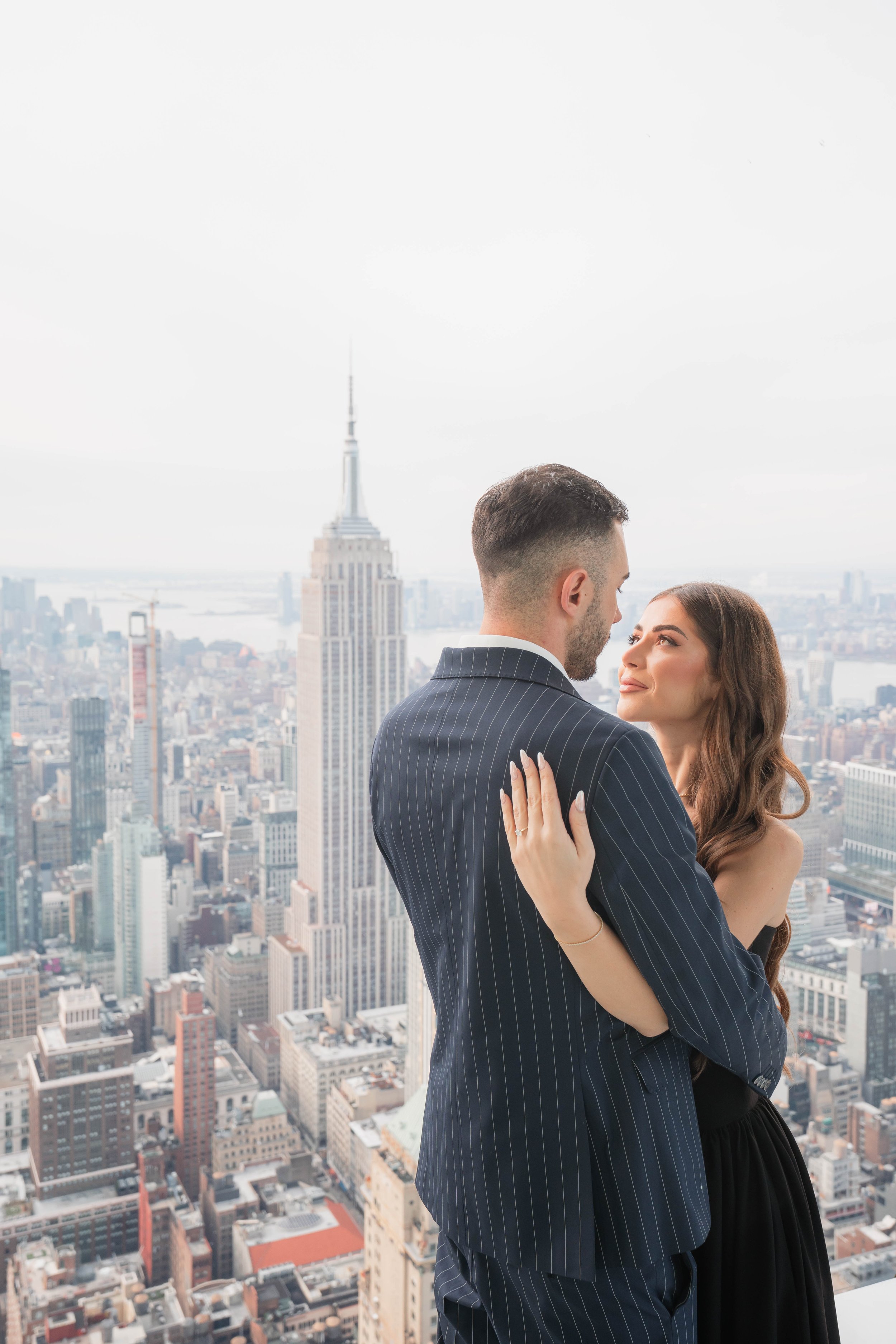 A beautiful marriage proposal and engagement photoshoot at SUMMIT One Vanderbilt in New York City captured by Matt Ritchie