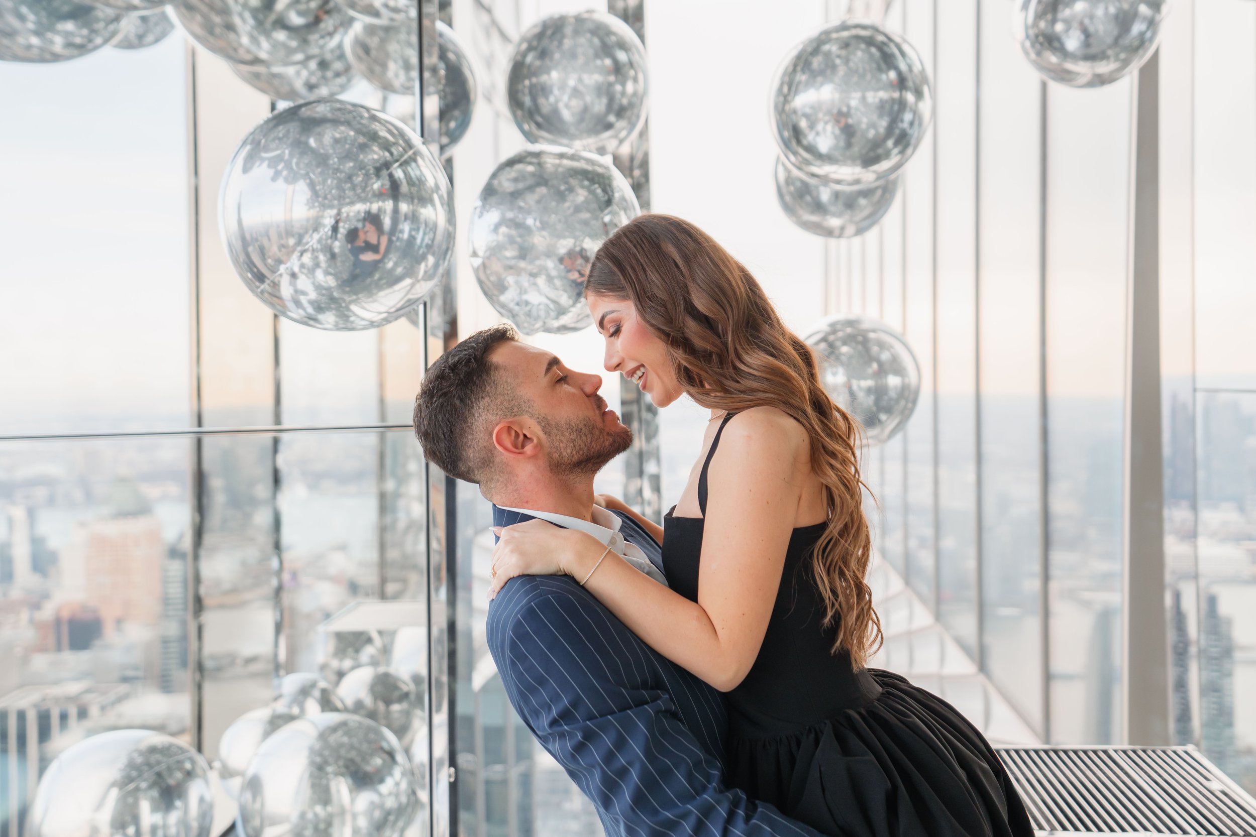A beautiful marriage proposal and engagement photoshoot at SUMMIT One Vanderbilt in New York City captured by Matt Ritchie