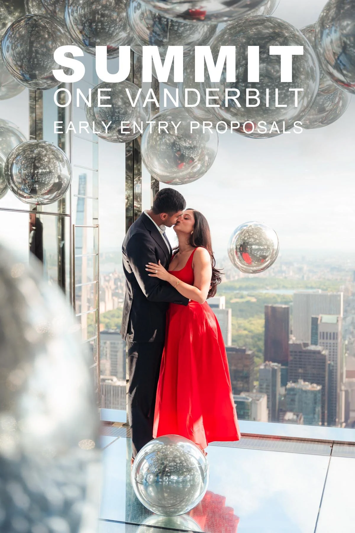 Engaged couple celebrating their proposal inside SUMMIT One Vanderbilt with city views