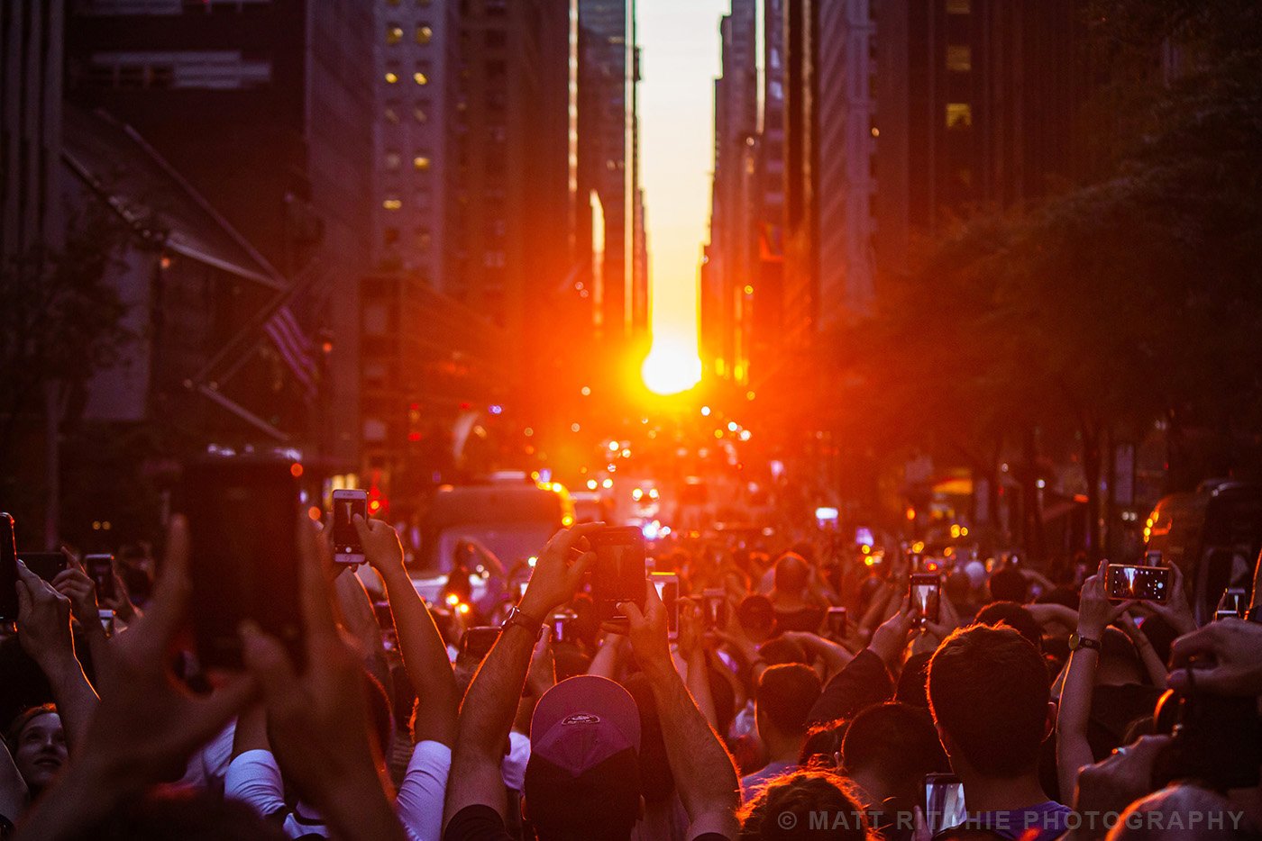 Crowd watching the Manhattanhenge during a summer sunset in New York City