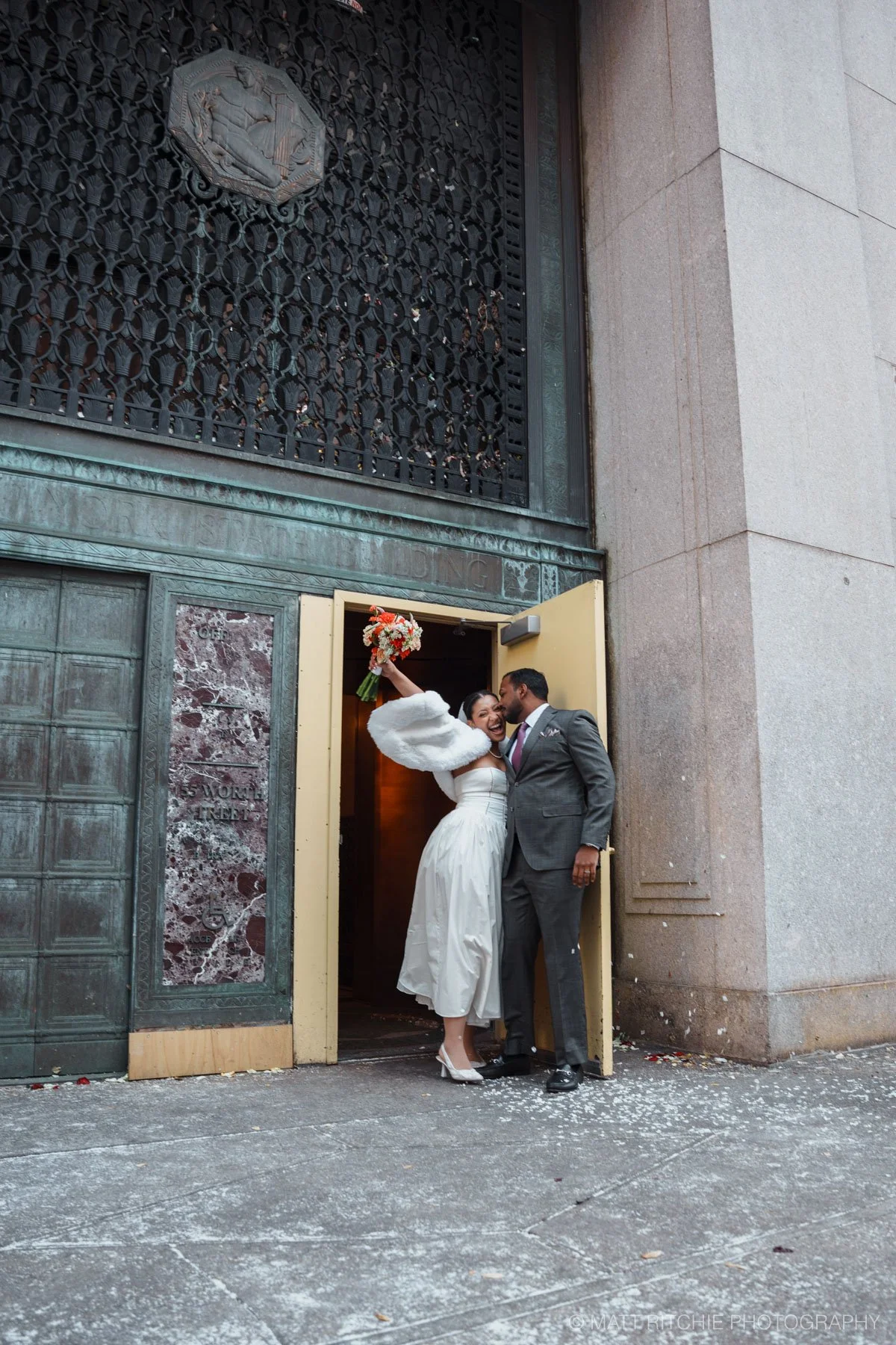 Couple celebrating after getting married at the Manhattan City Hall
