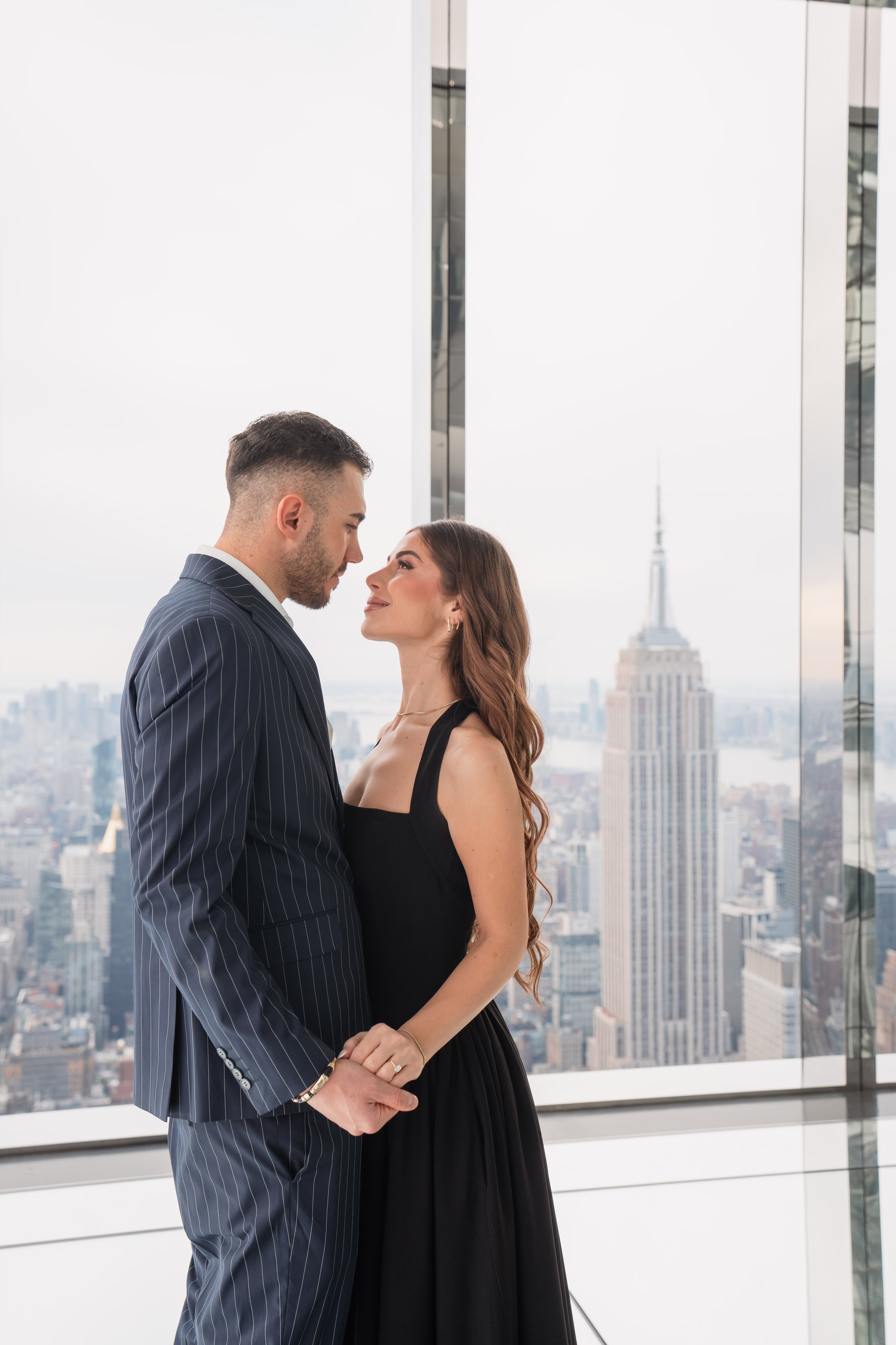 A beautiful marriage proposal and engagement photoshoot at SUMMIT One Vanderbilt in New York City captured by Matt Ritchie