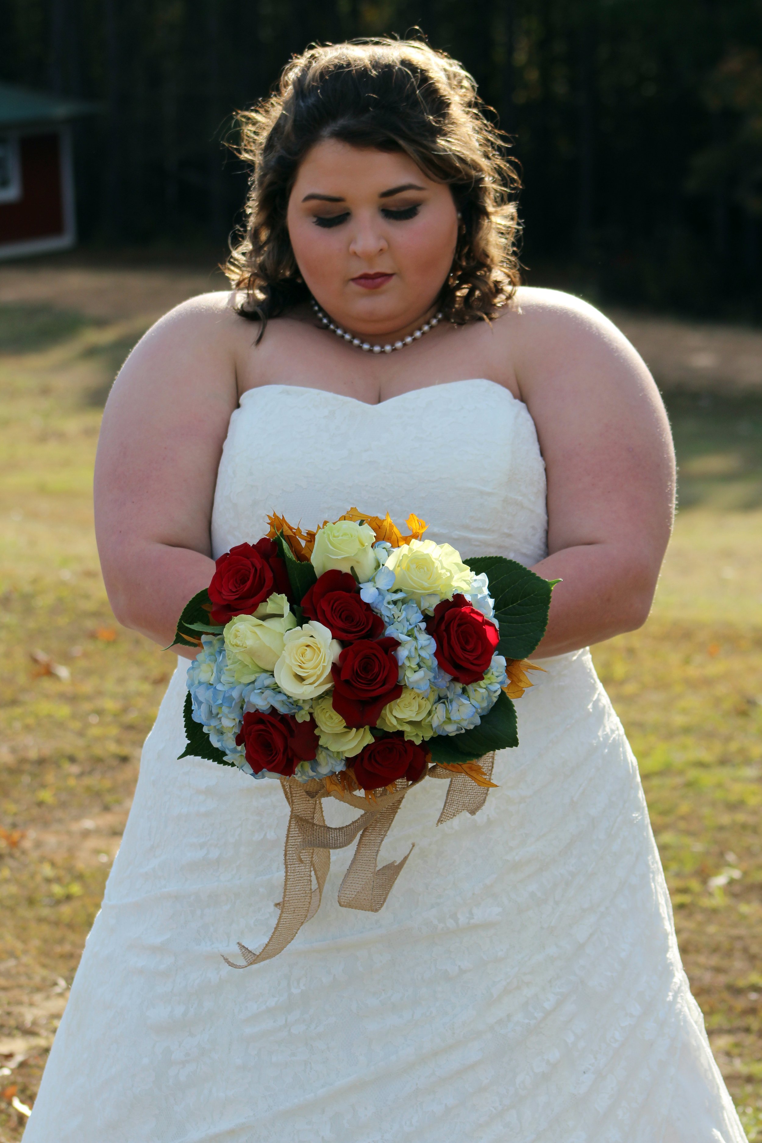 Bride Looking at Flowers.jpg