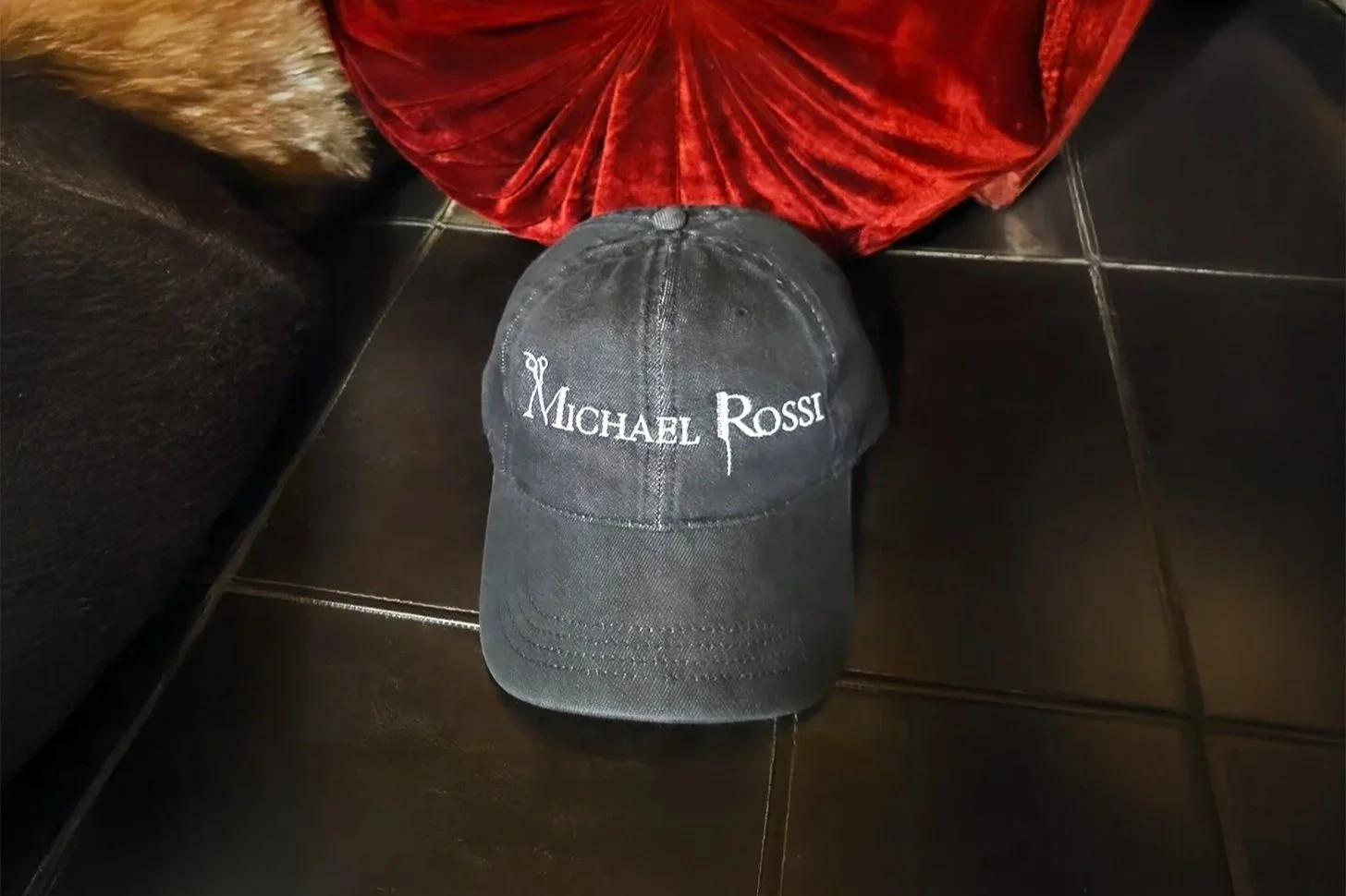 New logo design for the hair stylist, Michael Rossi. The logo will be featured prominently on baseball cap embroidery, showcasing a modern and stylish aesthetic that reflects Michael's brand identity. The design will incorporate unique elements that 