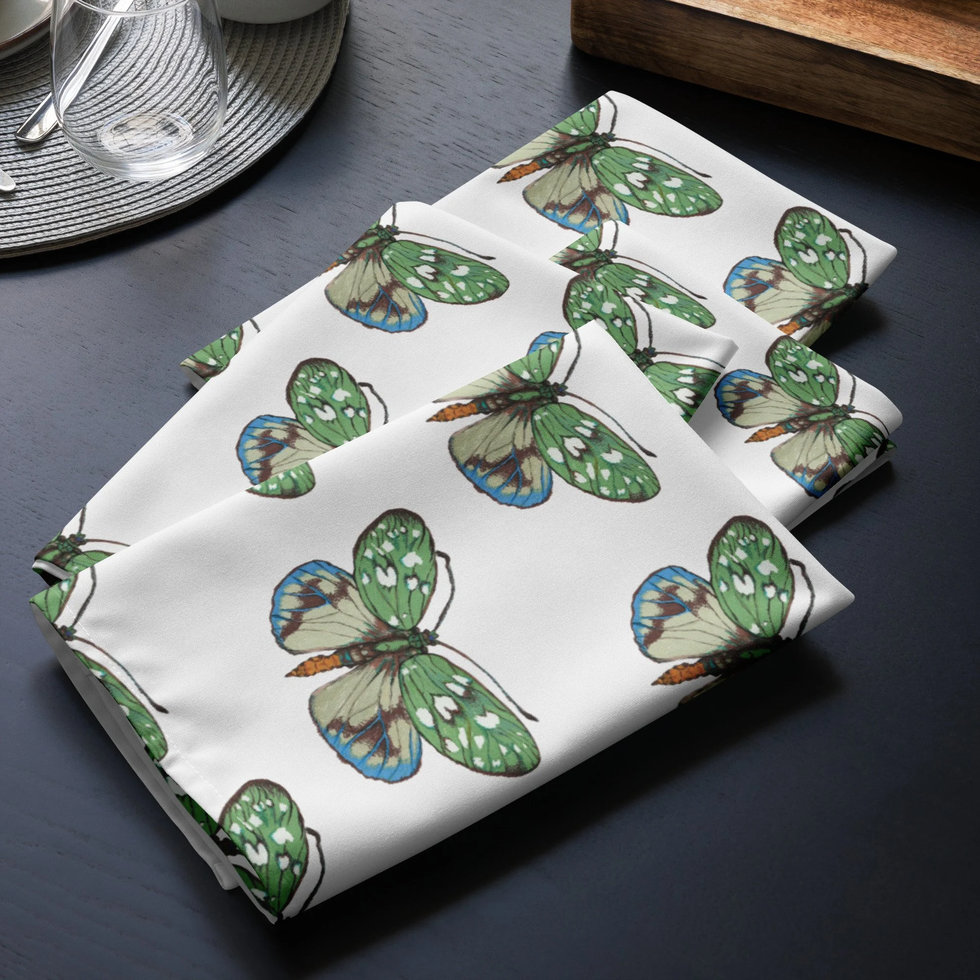 4 white cloth napkin set with repeating butterflies on a white background
