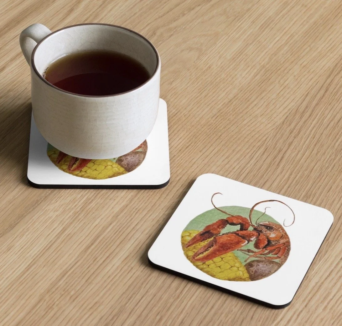 Coaster Featuring painting of a crawfish with large pinchers on a corncob and potato.
