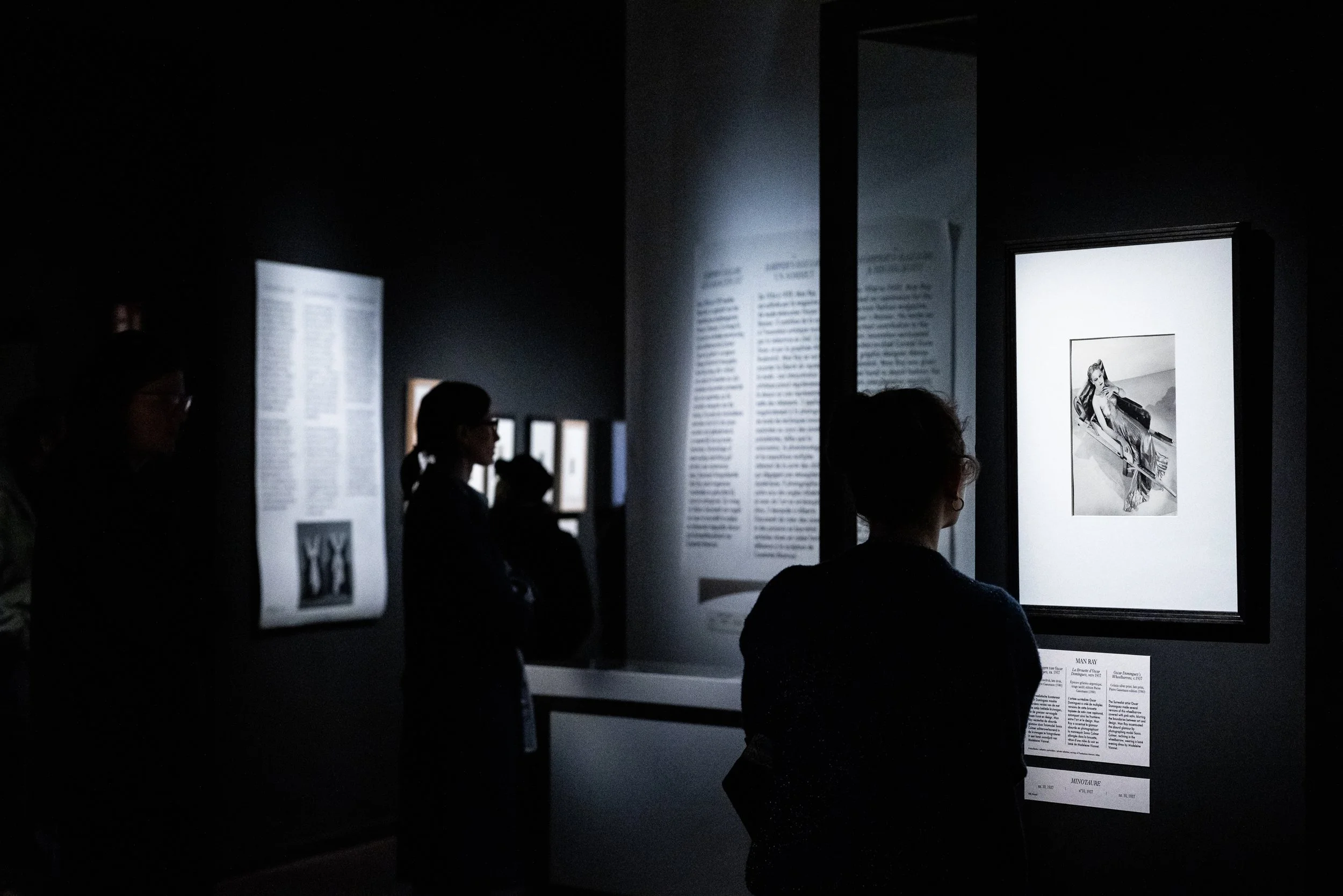 Silhouetted figure among Man Ray-inspired exhibits at MoMu Antwerp, photographed by Shruti Mehta
