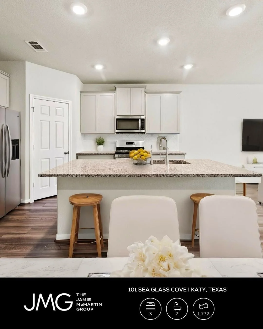 Comfort meets convenience in this home, where light-filled spaces and wood-look floors create a warm, inviting feel perfect for everyday comfort and easy living.

Gather in the open-concept kitchen with quartz countertops and a large island, flowing 