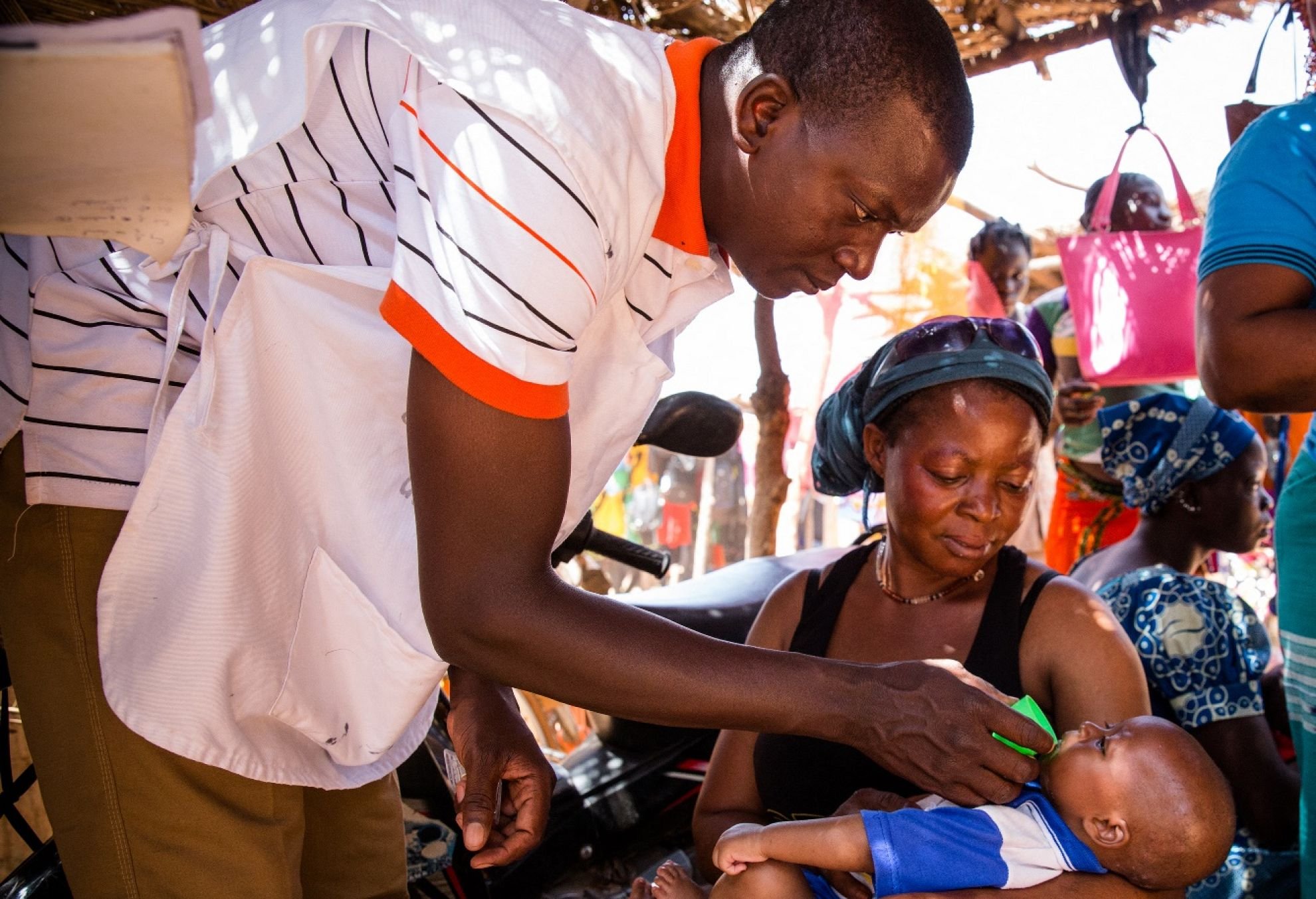 Child receiving SMC treatment from the Malaria Consortium