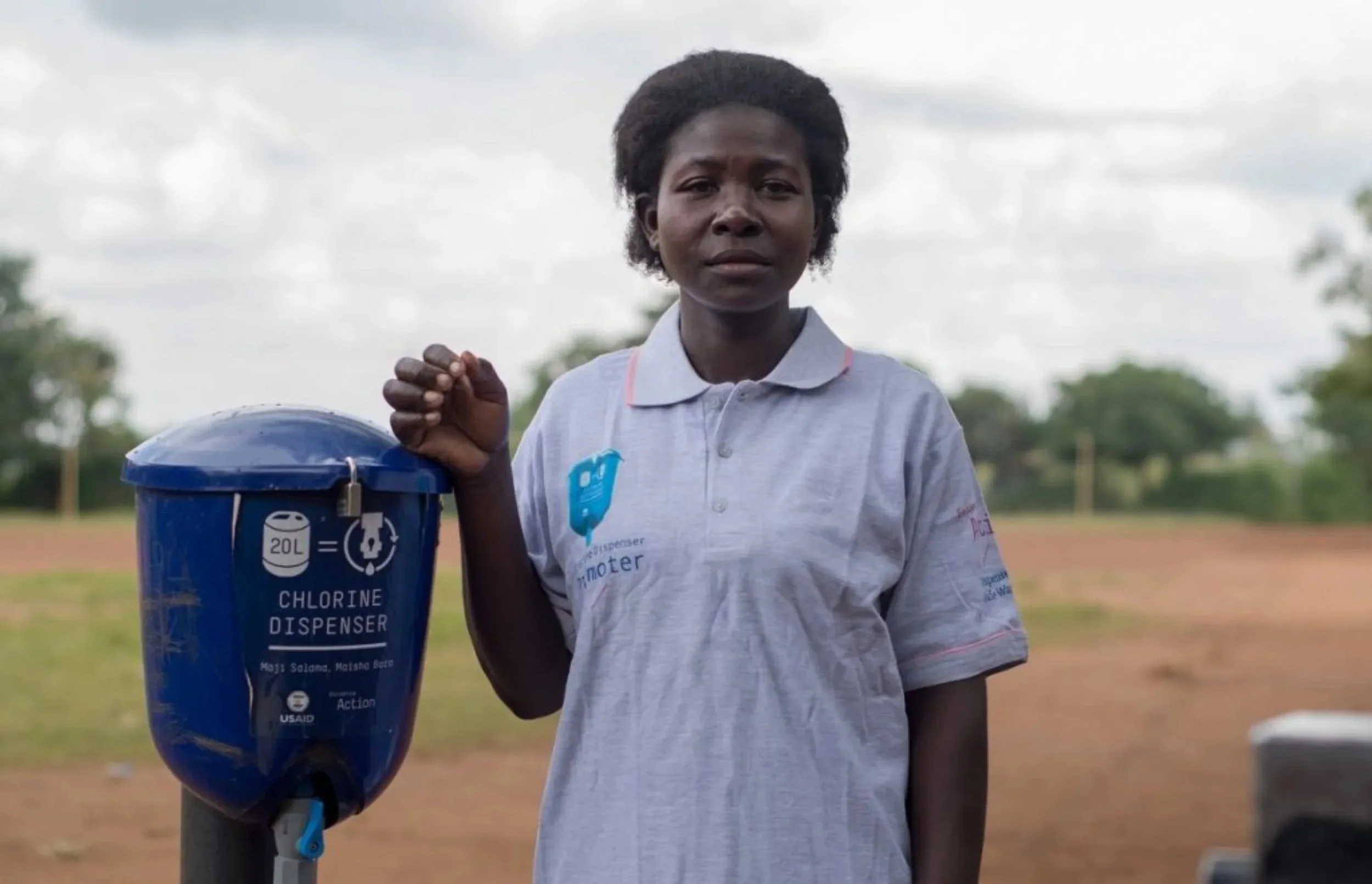 Woman with chlorine dispenser.jpeg