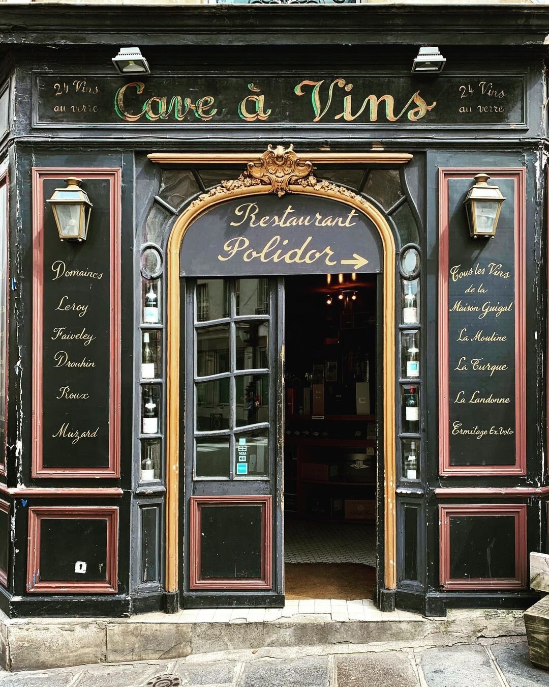 Emily Taubert on Instagram_ “Cave à vins _ Wine cellar 🍷 #lepolidor #saintgermain #leftbank #rivegauche #paris #restaurant #parisbar #vintage #typography #topparisshops”.jpeg