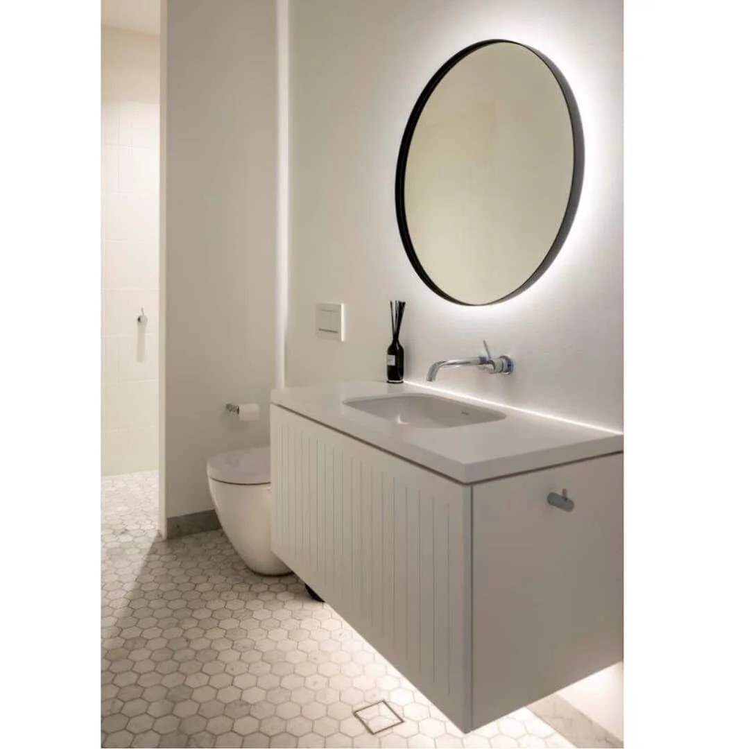 What do you think of our simple, yet inviting, powder room? &nbsp;The concealed LED lighting helps create a warm and soothing space for your personal use or for that of your guests. 💄

Scroll left to see our Zen-like ensuite which offers a restful a