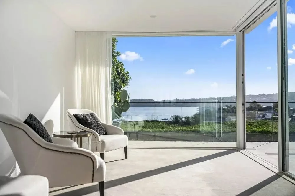 Within this Eastern Suburbs home, the architecture is shaped as much by outlook as it is by space, with the design carefully oriented to capture sweeping harbour views and draw natural light deep into the home.

Expansive sliding glass openings revea