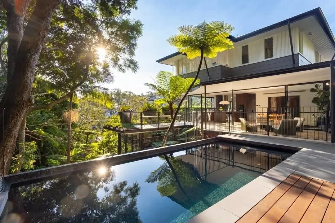 Positioned to engage closely with its surrounding landscape, Victoria&rsquo;s home, 24L, opens to a series of outdoor spaces layered across the site.

An elevated terrace extends from the living areas, overlooking a pool set within the natural slope.