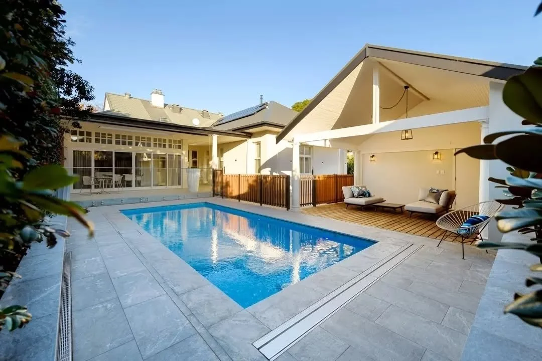 1C brings together a new terrace, pool and garden spaces designed around outdoor living and family entertaining.

Extending from the kitchen, the terrace overlooks the resized pool and north-facing cabana, with granite paving and soft landscaping sof