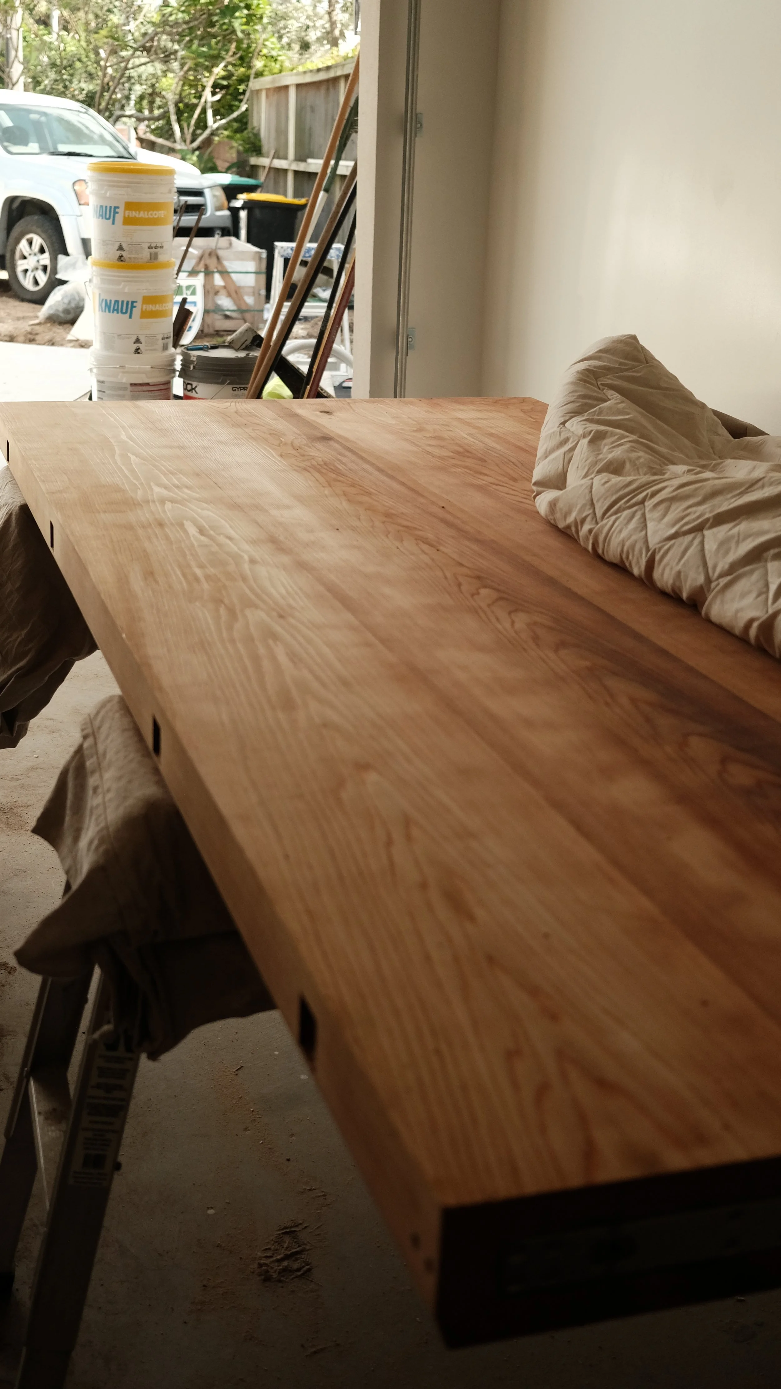 Solid cedar front door in construction on site