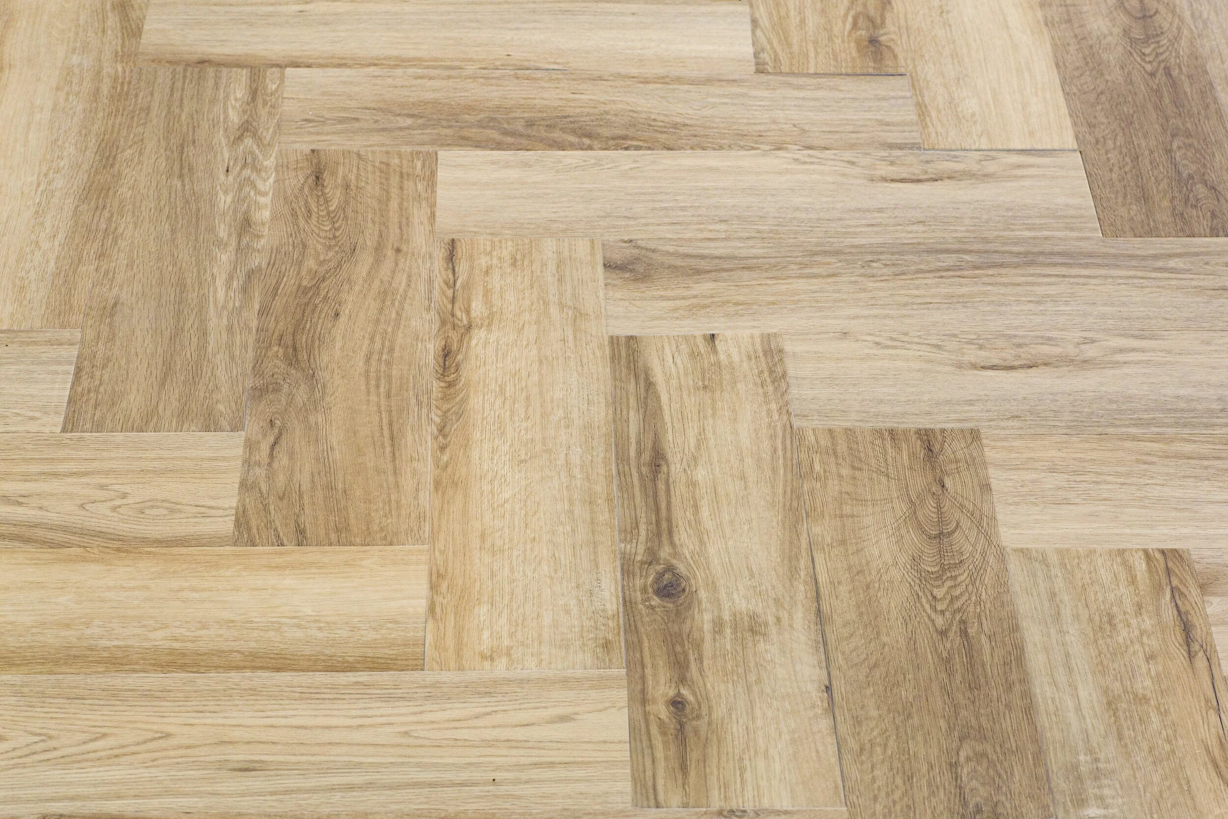 laminate-parquet-with-herringbone-background-wooden-floor-with-chevron-pattern-min.jpg