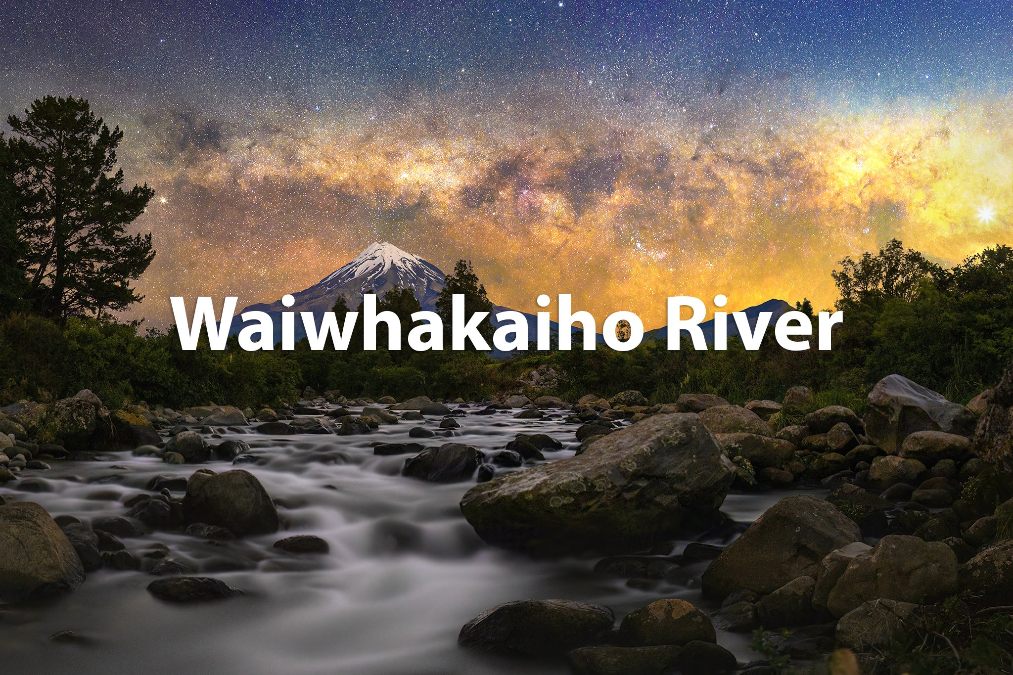 Nighttime view of Waiwhakairo River flowing over rocks with mountains and a starry sky, including the Milky Way, in the background.