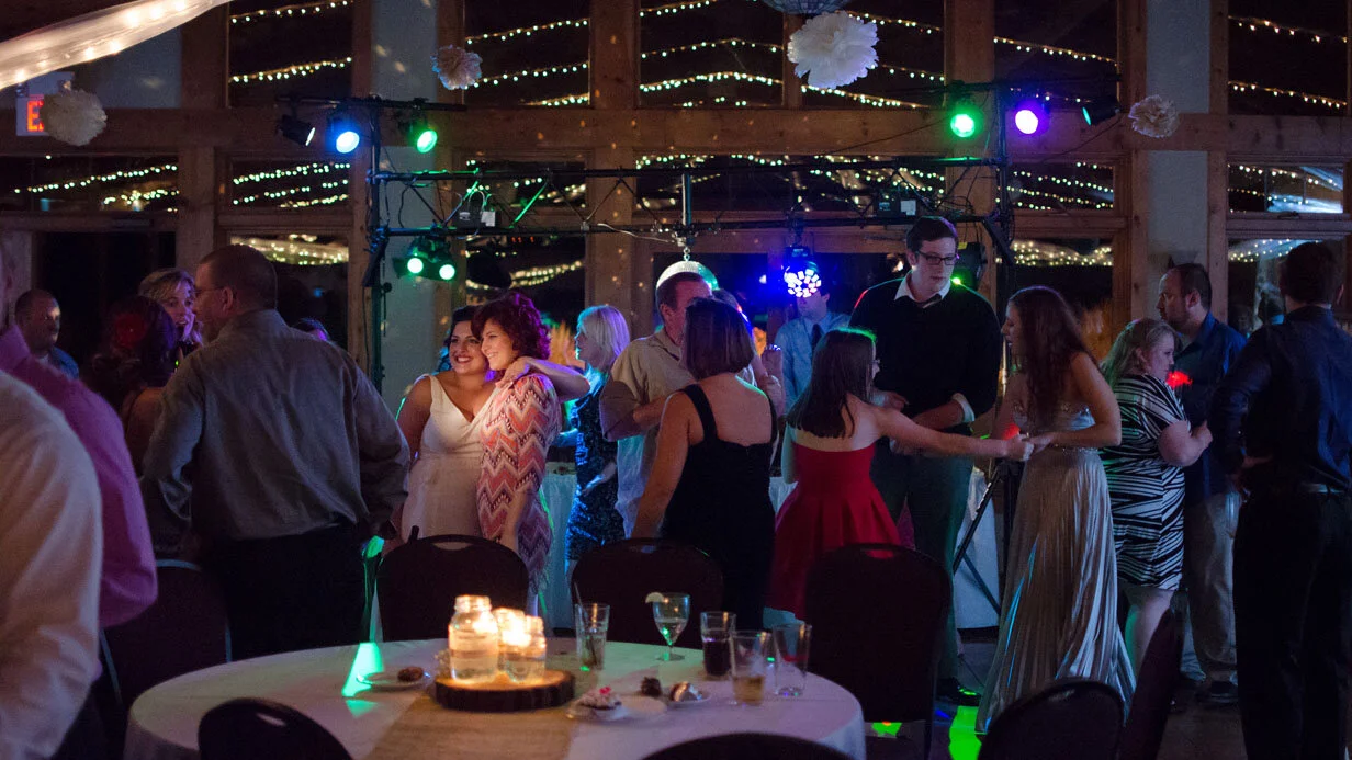 People dancing and socializing at a lively indoor event