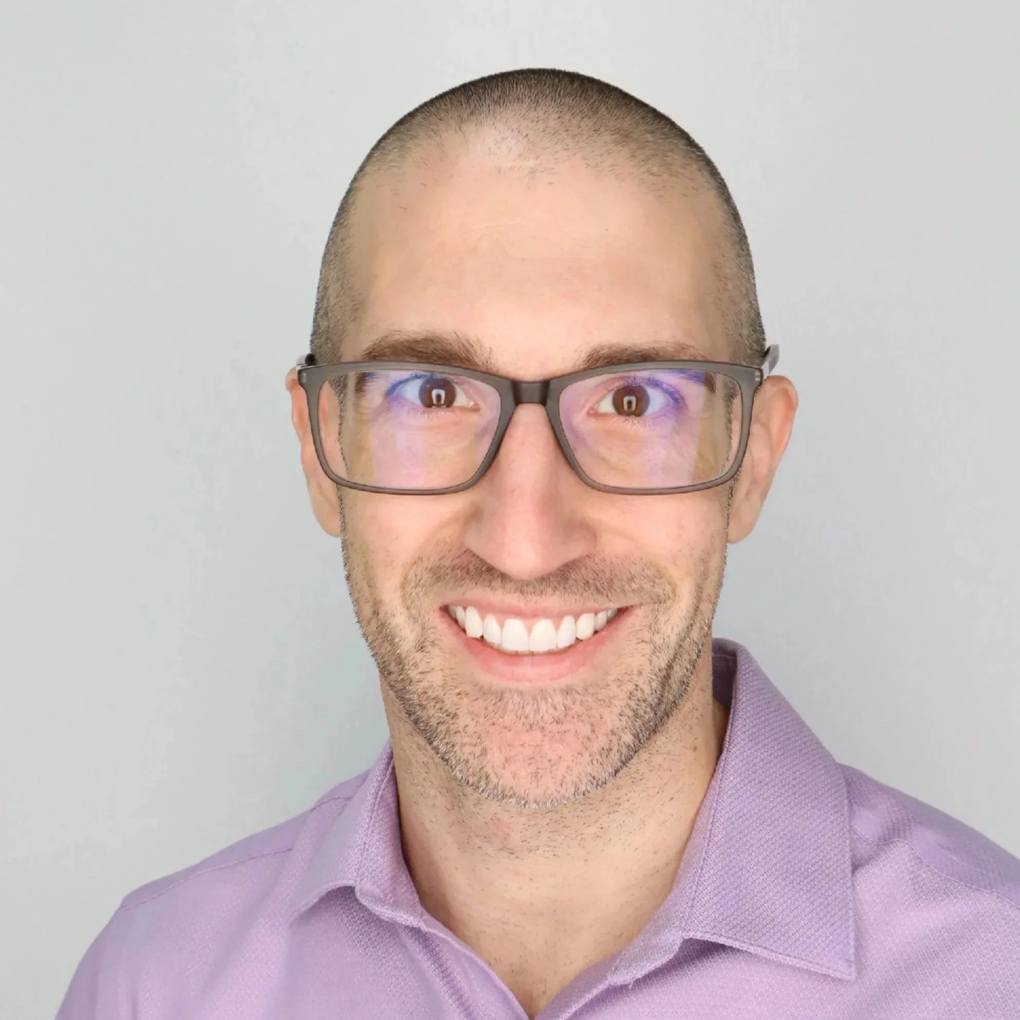 photo of smiling man with glasses