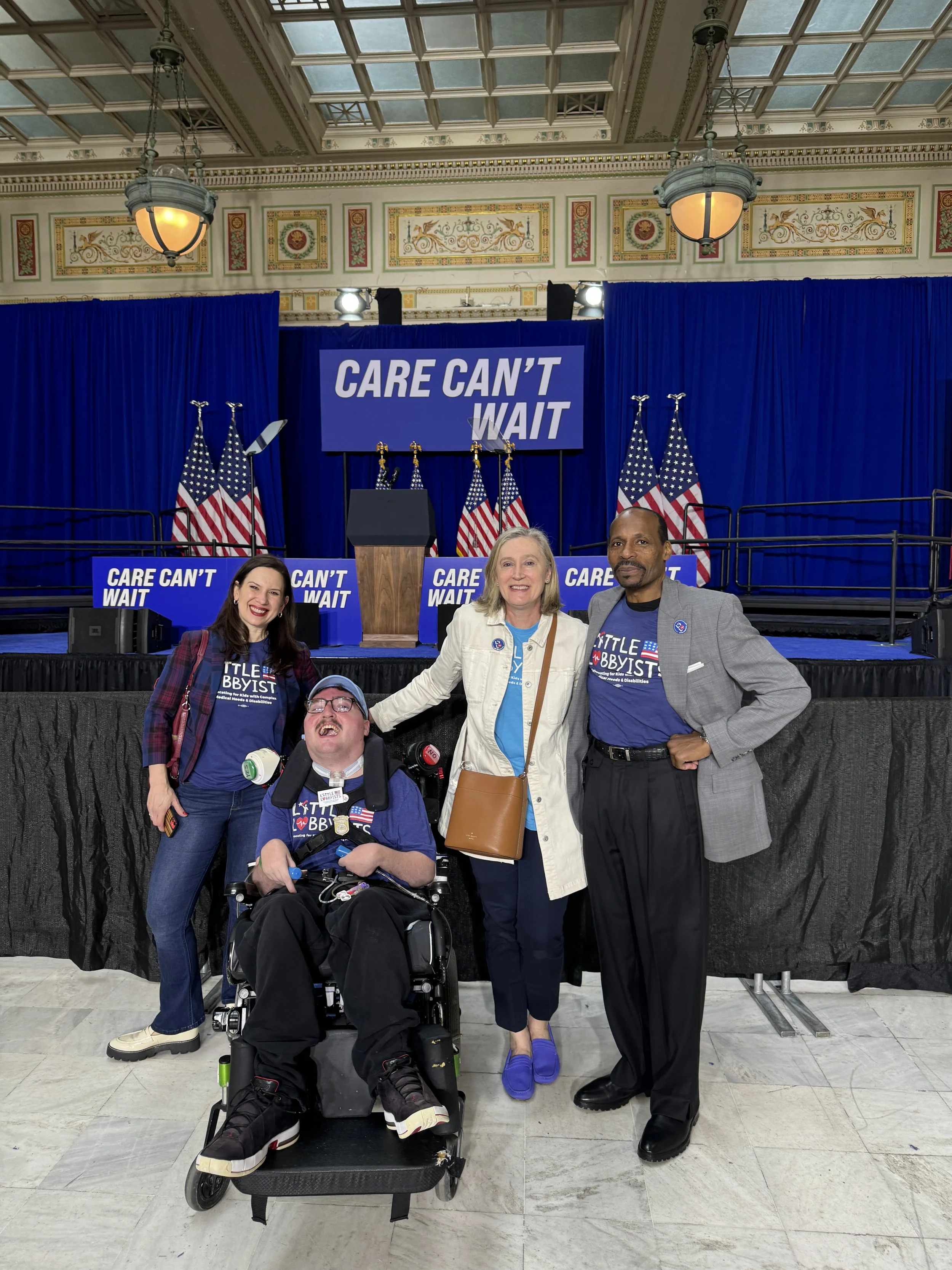 Rob poses with members of Little Lobbyists at after a Care Can't Wait rally