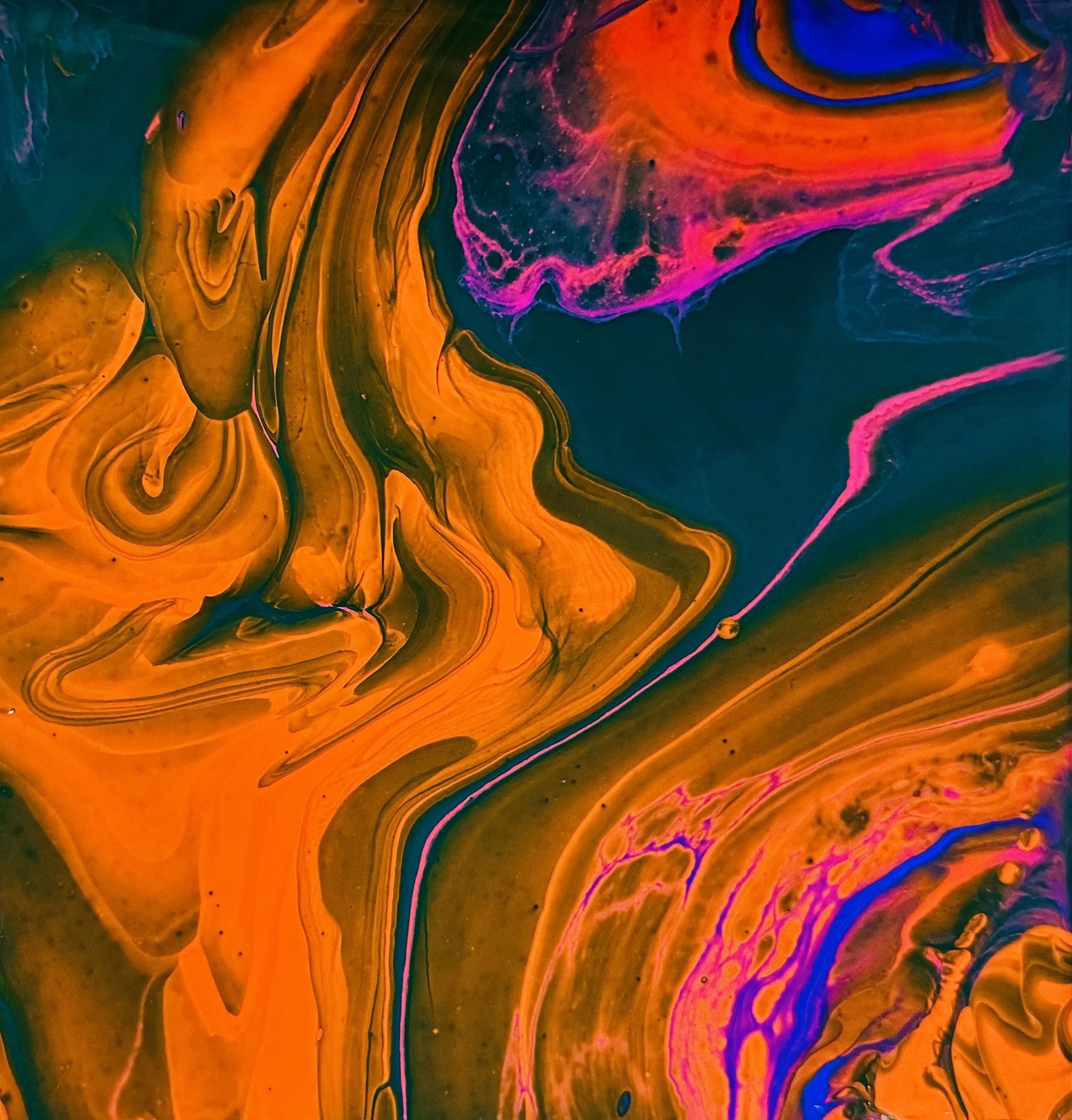"Space-time": vivid orange, purple and pink paint flows in river-like patterns on a dark blue background.