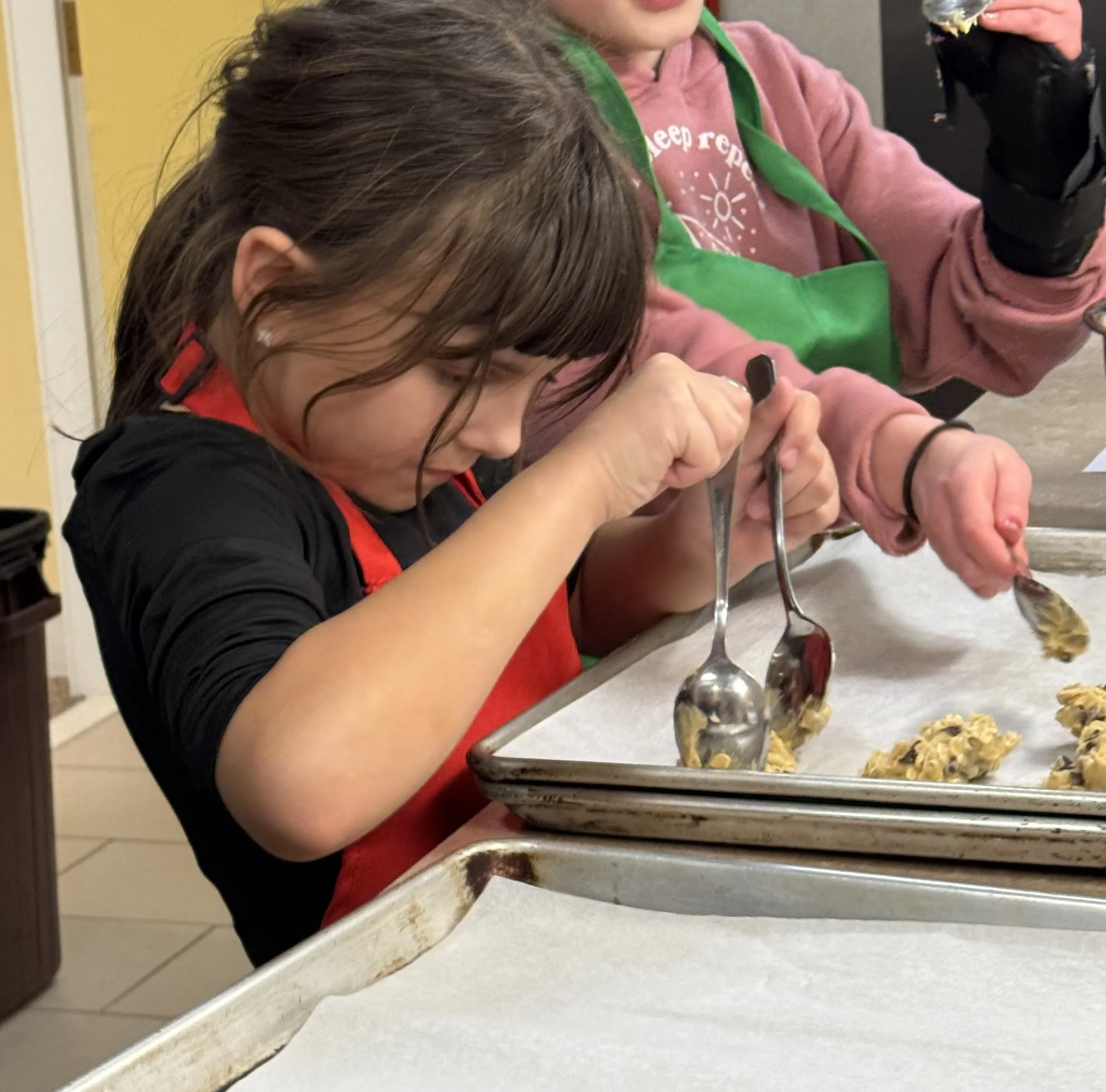Food prepping for neighbors in need at Cooking for a Cause