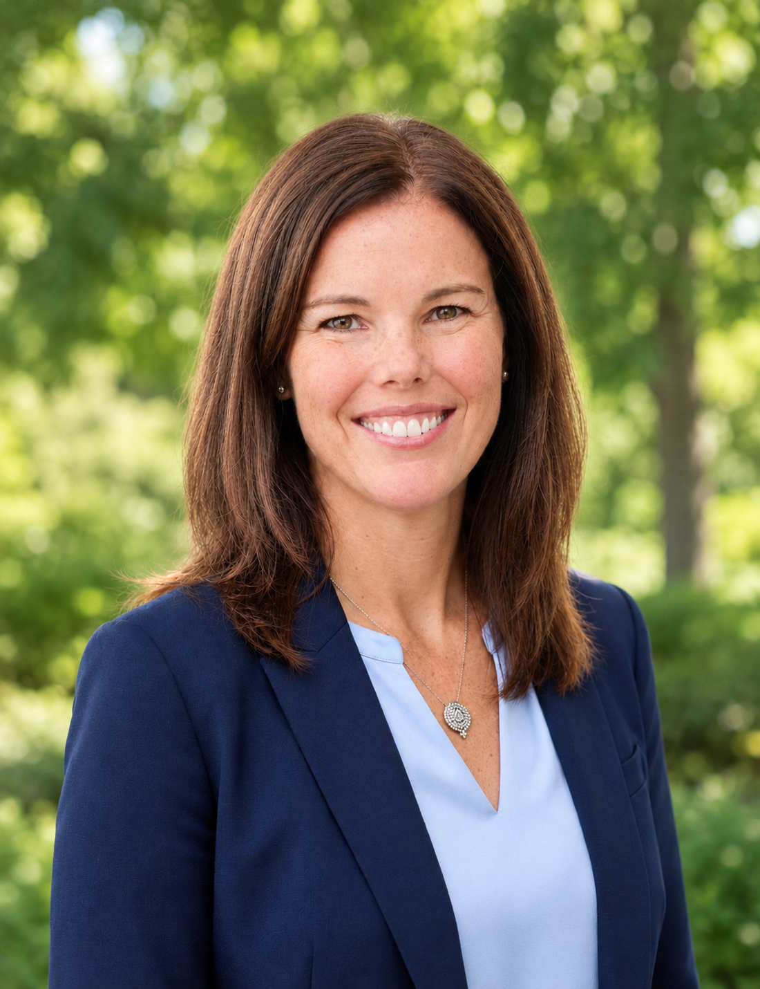 Smiling woman with an outdoor background