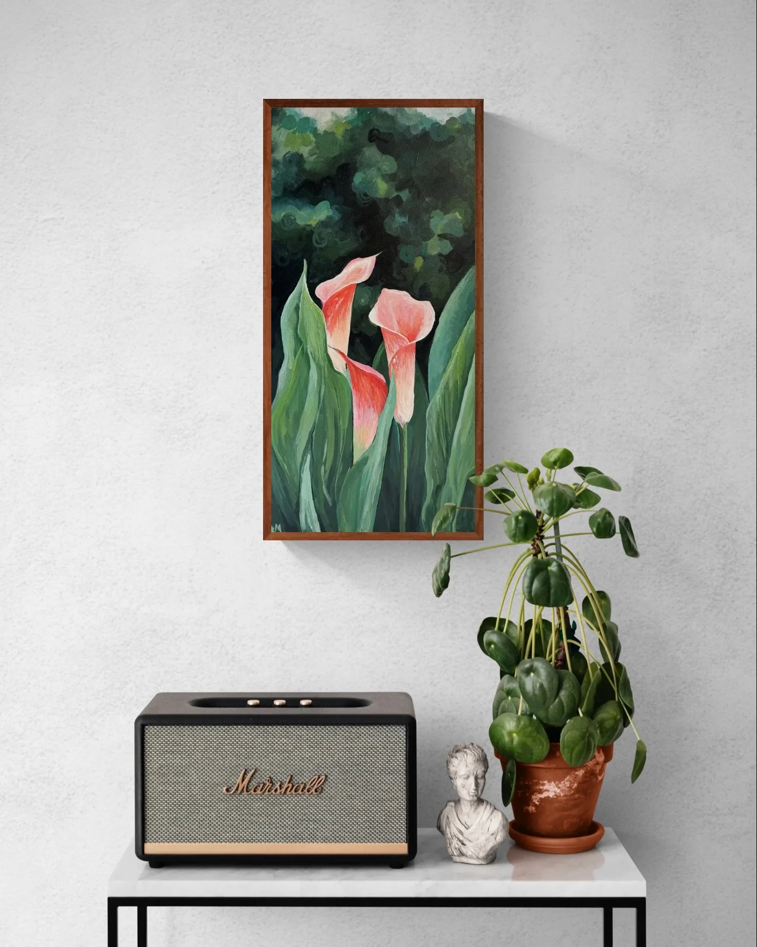 Console table with a speaker and potted plant.jpeg