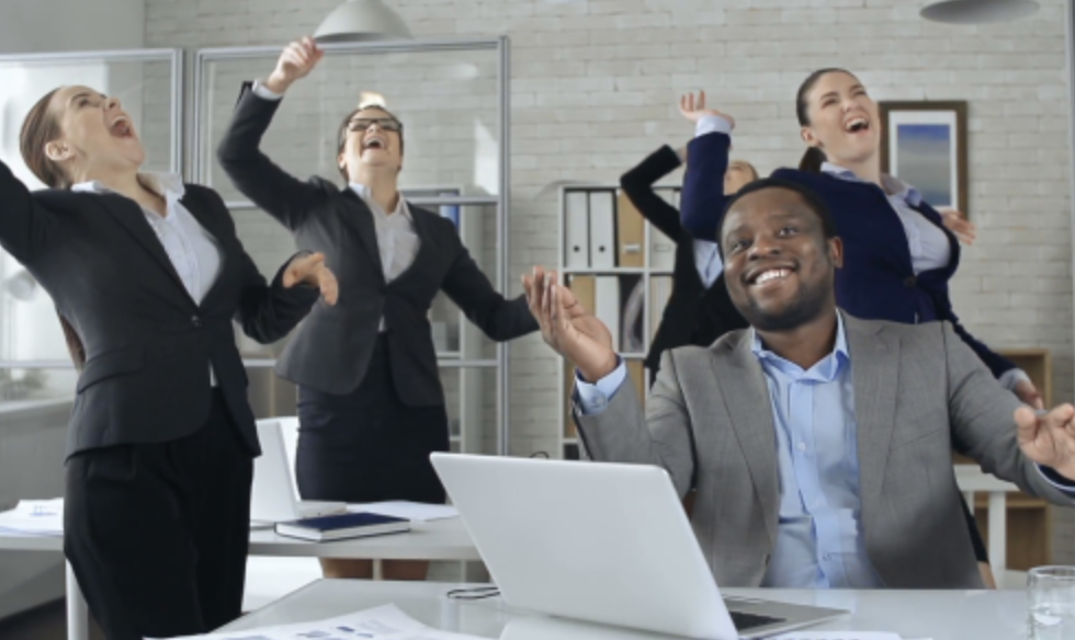 Illustration of a female superhero with long hair, wearing a pink costume, yellow gloves, and a cape.