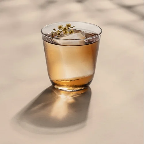 Bar Iris in San Francisco, light brown cocktail in a short glass with a large clear ice cube.