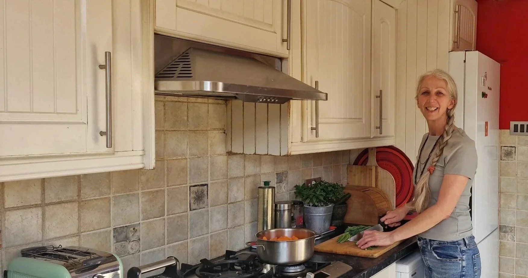 katja patel in kitchen chopping vegetables
