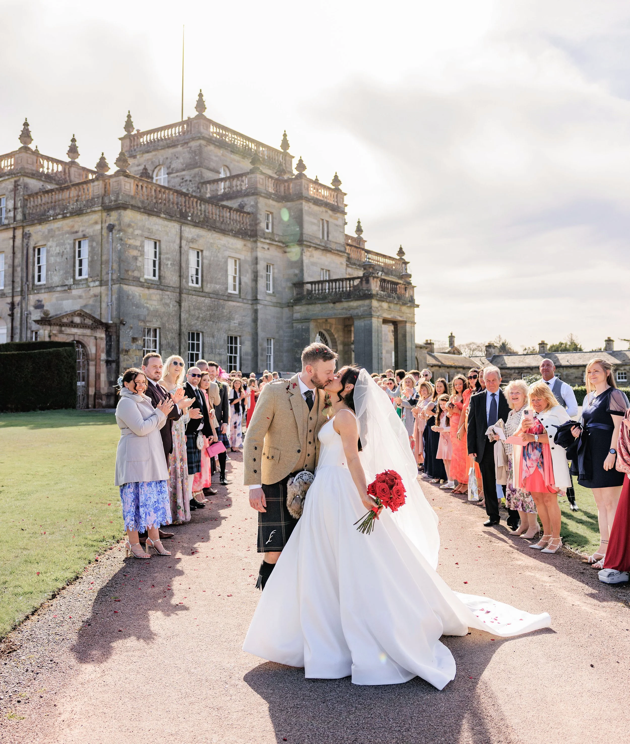 Bride putting in her white earing