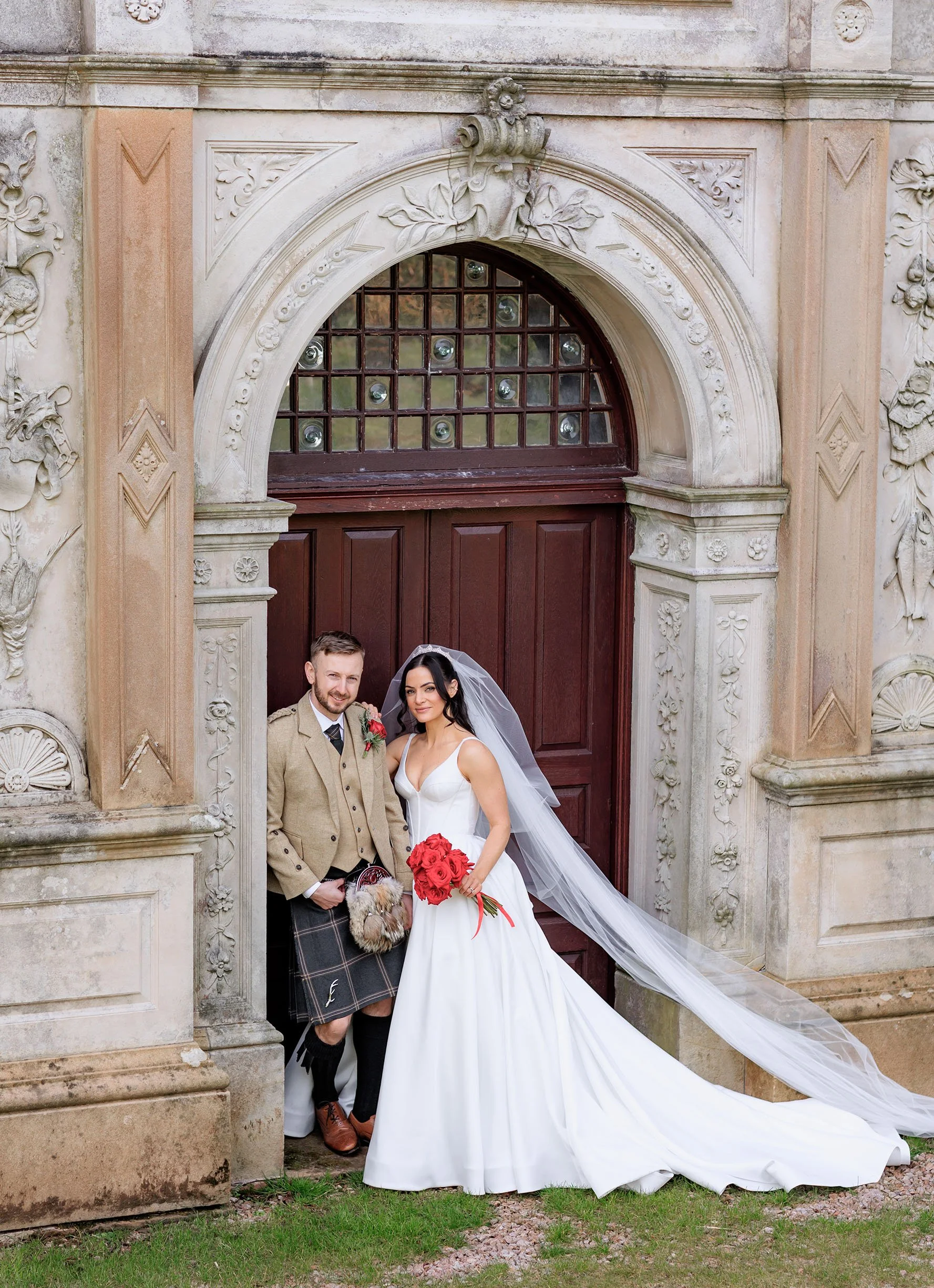 Nadine Coyl as bridesmaid fixing the bride's veil.