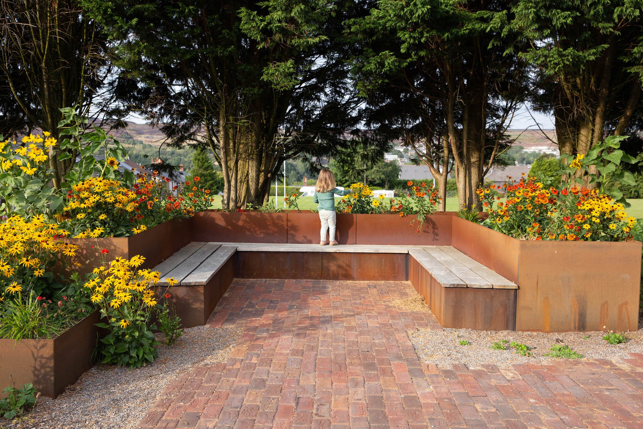 RHS Community Garden Victoria Wade oak benches.jpeg