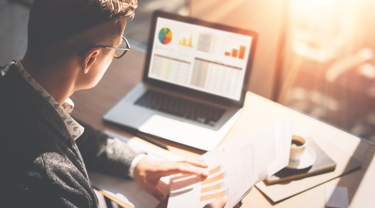 Outsource CFO working at computer