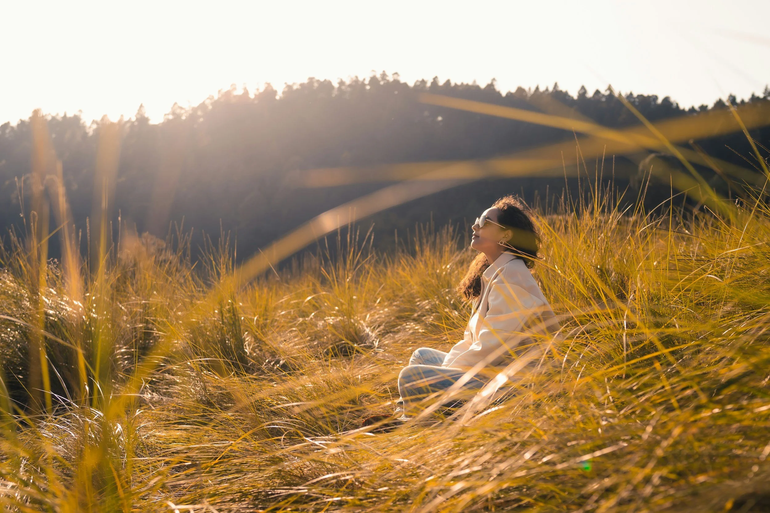 woman sitting in a field