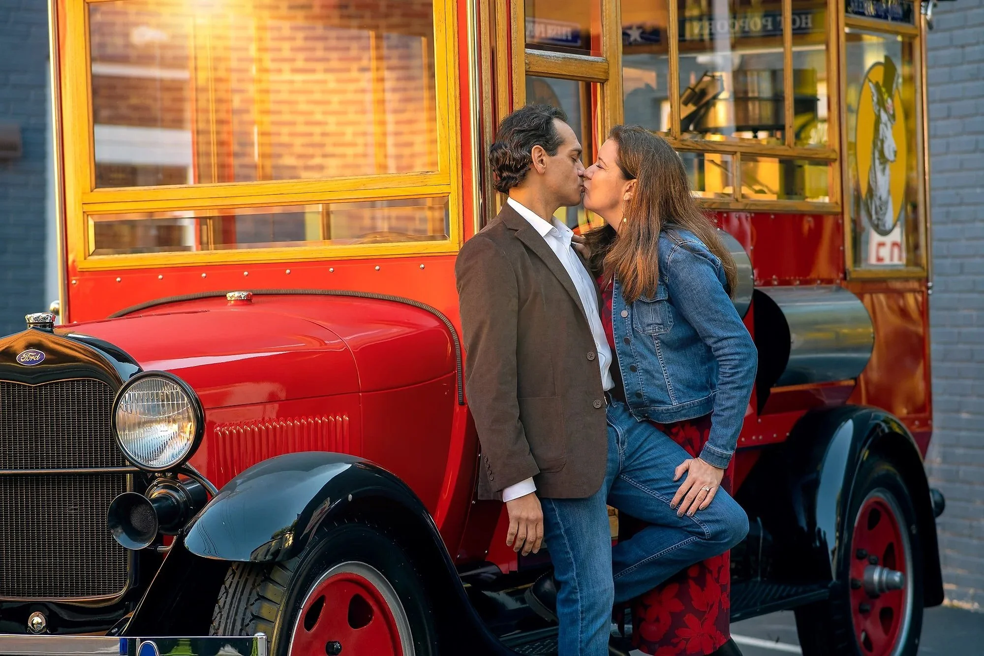 A man and woman sharing a kiss in front of a vintage red and yellow truck. Best-Fashion-Portrait-Commercial-Business-Headshots-Corporate- photography-Maryland-Washington D.C.-Pennsylvania-Virginia