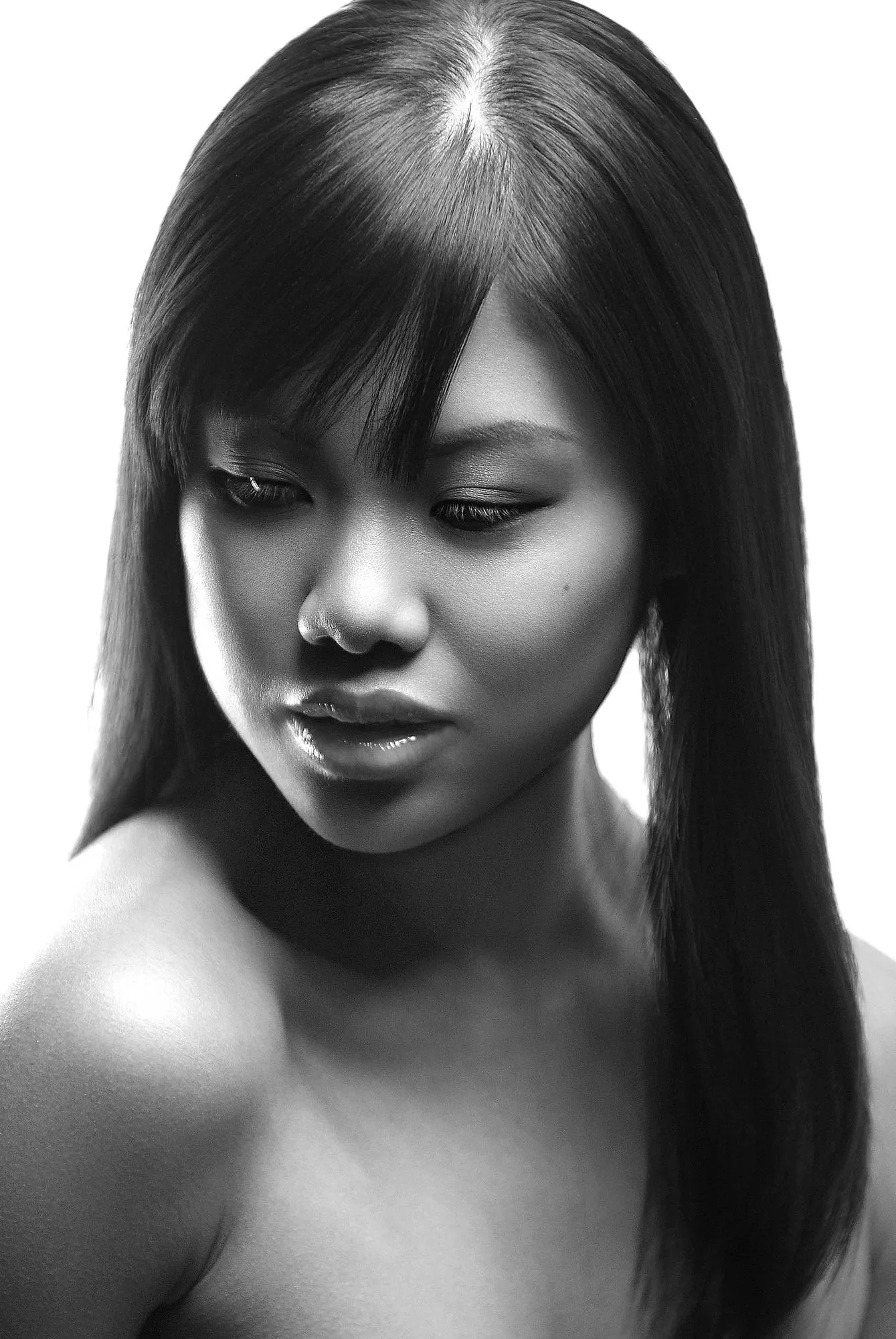 Black and white portrait of a woman with straight hair looking down. Best-Fashion-Portrait-Commercial-Business-Headshots-Corporate- photography-Maryland-Washington D.C.-Pennsylvania-Virginia