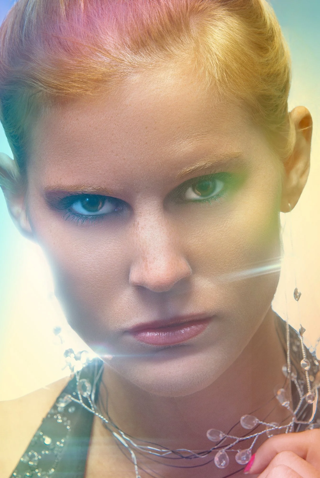 Close-up of a woman with blonde hair and striking makeup, wearing jewelry, looking directly at the camera with a serious expression. Best-Fashion-Portrait-Commercial-Business-Headshots-Corporate- photography-Maryland-Washington D.C.-Pennsylvania-Virg