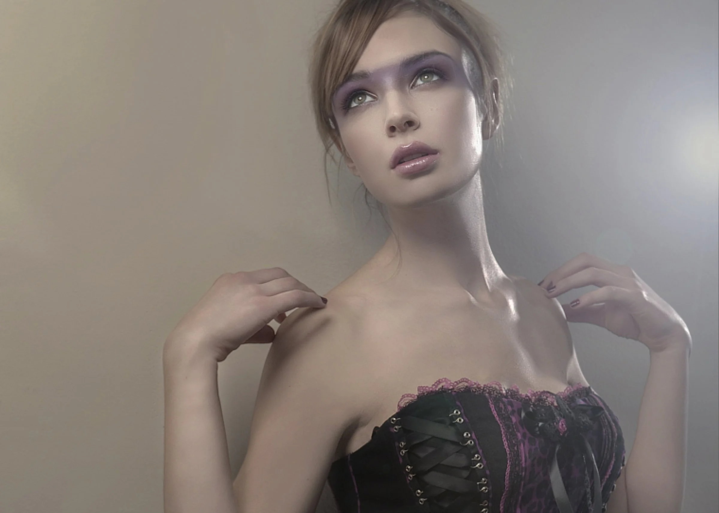 A woman with short hair and dramatic makeup, wearing a black and purple corset, looking upwards with her hands near her shoulders. Best-Fashion-Portrait-Commercial-Business-Headshots-Corporate- photography-Maryland-Washington D.C.-Pennsylvania-Virgin