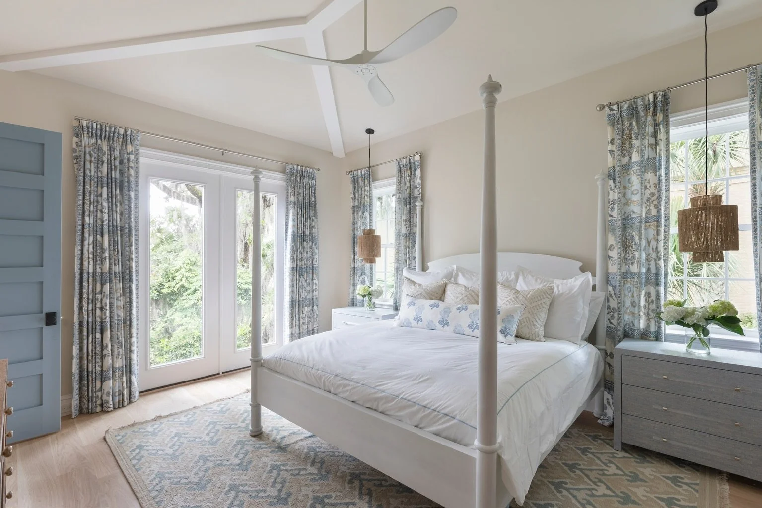 Soft blues, layered textures, and a bedroom designed to feel like a retreat. The pendant lights, the custom drapery panels, and the overall softness of the space all come together to create such a calming feel that we love! 

#bedroomdesign #primaryb