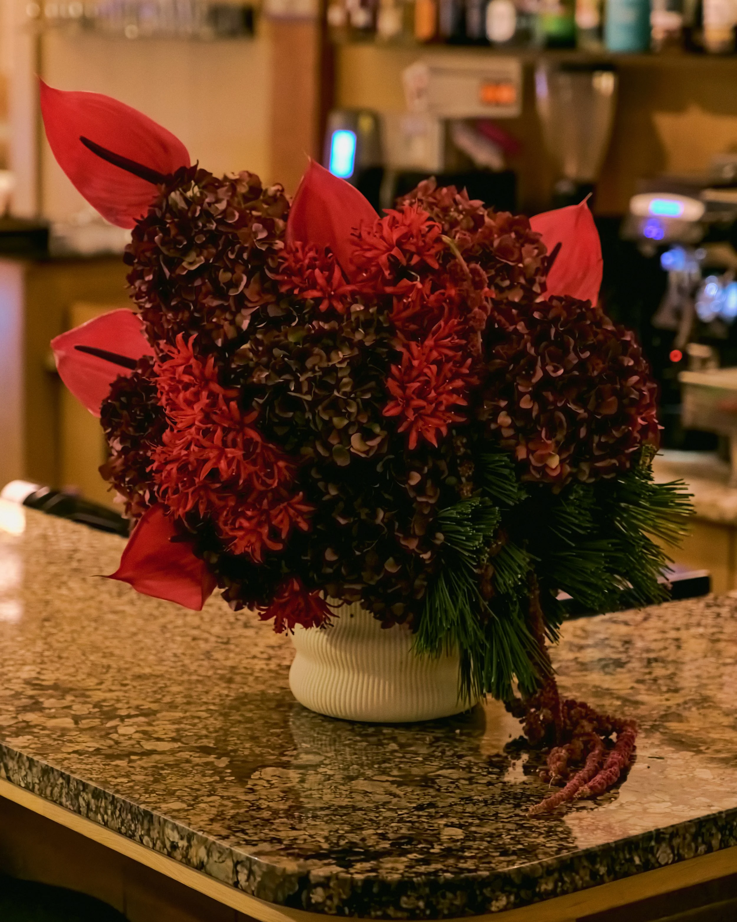 A large moody holiday floral piece by Asher Fleurs for Tik Tok